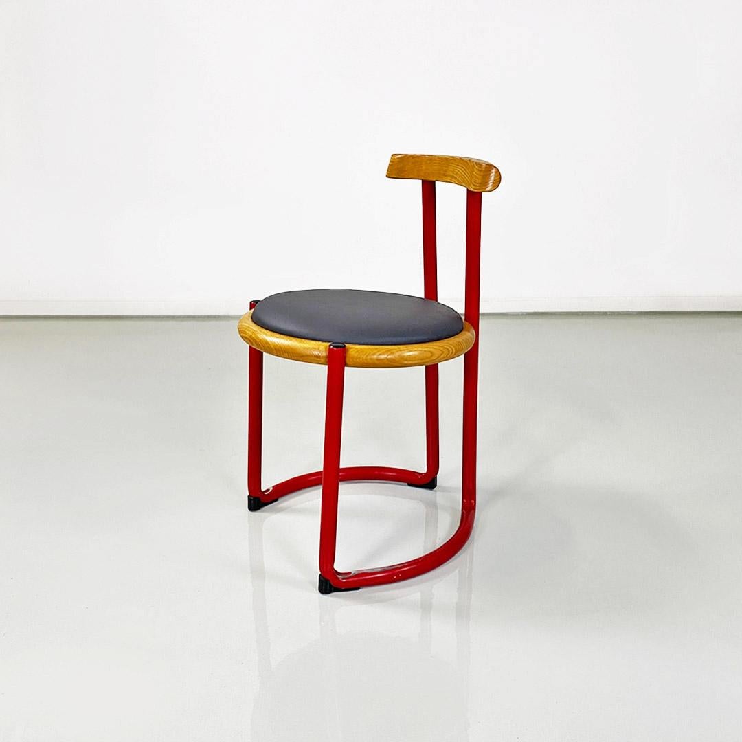 Italian mid century red metal, wood and faux leather chair by Tito Agnoli, 1960s.
Chair with red painted tubular structure, with round-shaped seat in light-colored solid wood, with padded cushion covered with new gray imitation leather. Backrest