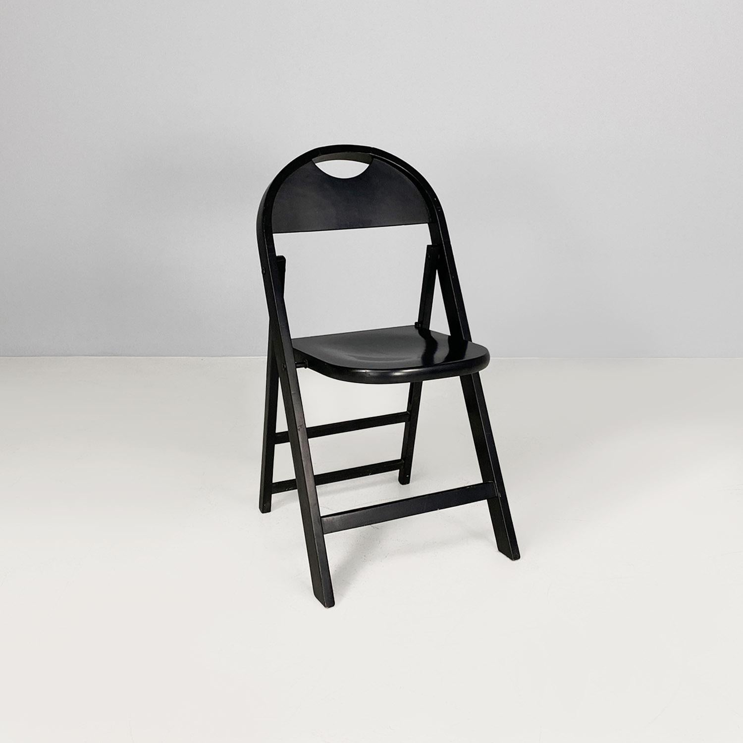 Tric model folding chair, made entirely of wood painted in black, with a rounded seat and back. The legs are rectangular in cross-section.
Produced c. 1960 and designed by Achille and Pier Giacomo Castiglioni.
Good condition, light scattered marks
