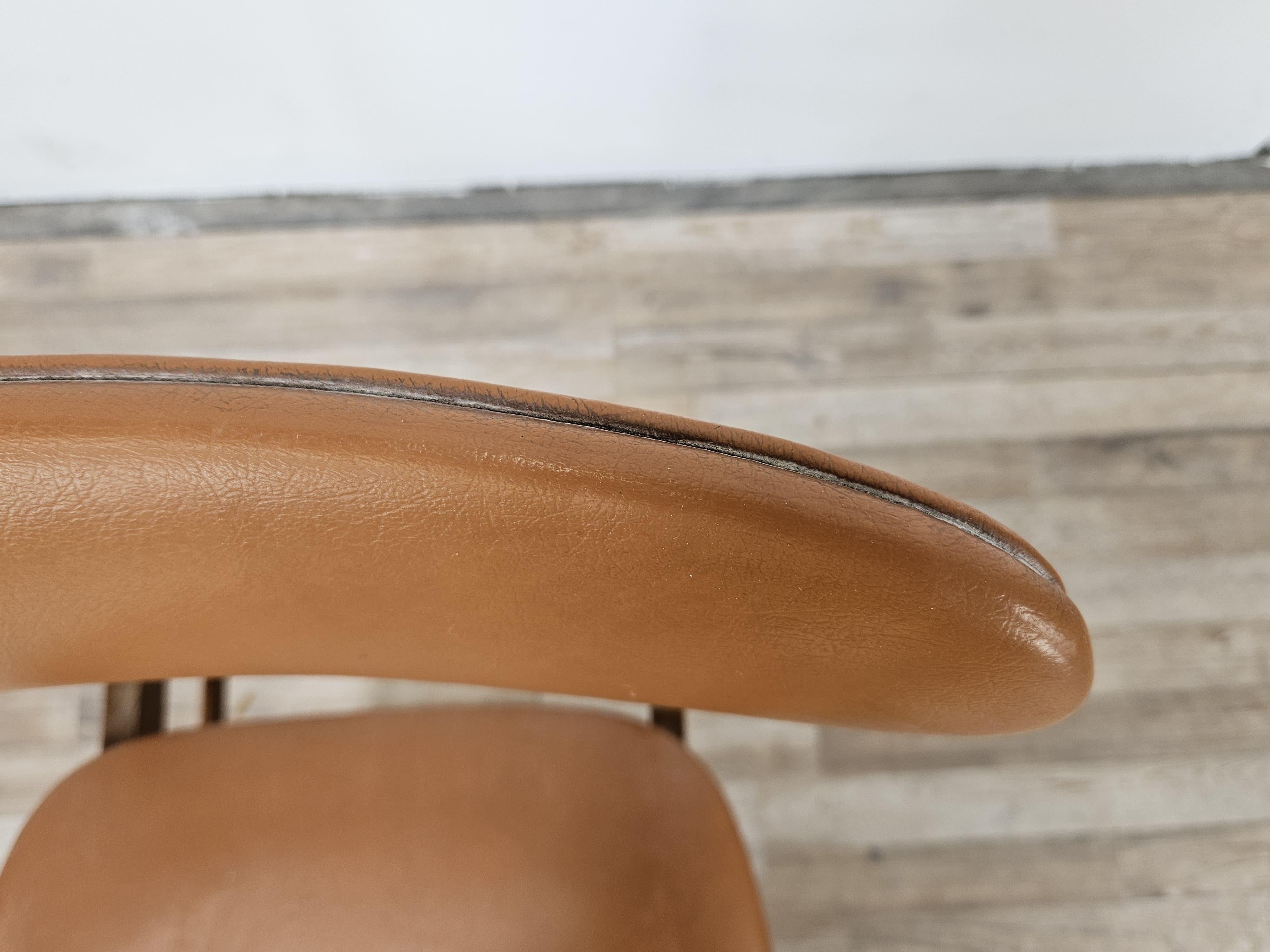 Hide Scandinavian 1970s teak and brown skai chair For Sale