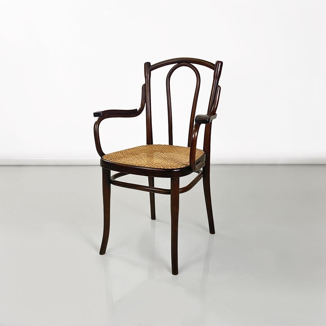 Thonet chair with wood and straw arms from Vienna, Austria, early 1900s.
Thonet chair with arms and frame made entirely of walnut wood and with a new, handmade Vienna straw seat.
Produced by Thonet in the early 1900s.
Restored and in perfect