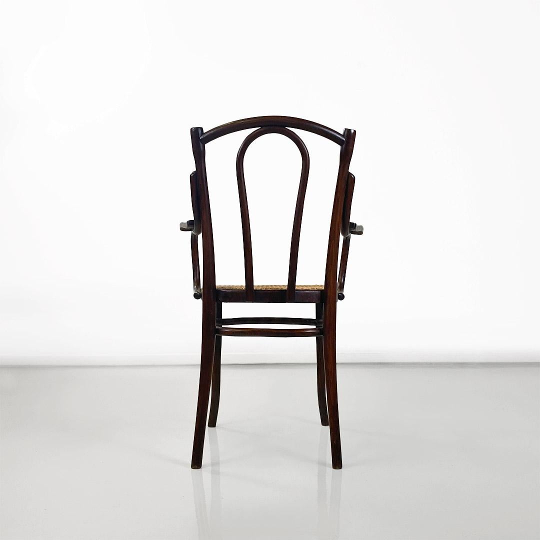 Austrian Thonet chair with arms made of wood and Vienna straw, Austria, early 1900s For Sale