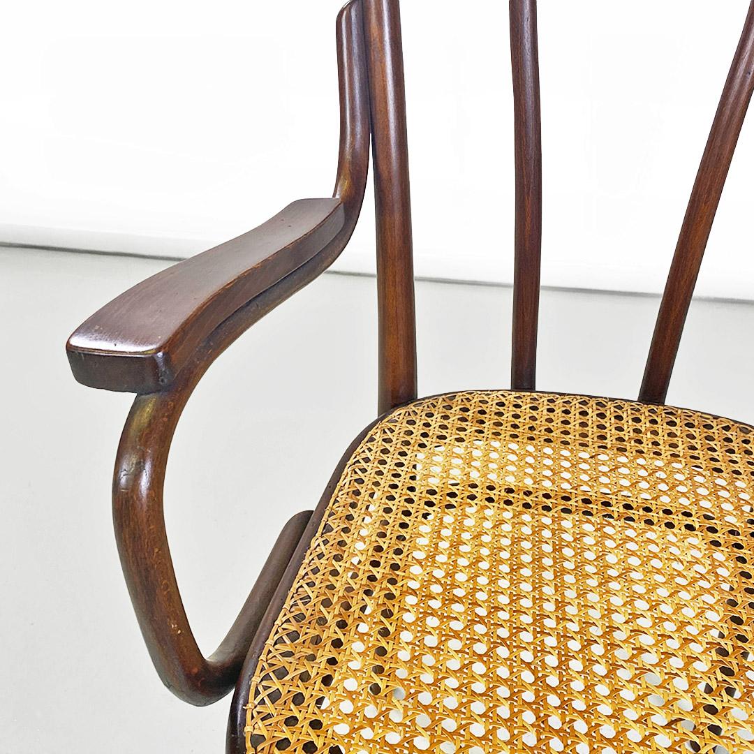 Early 20th Century Thonet chair with arms made of wood and Vienna straw, Austria, early 1900s For Sale