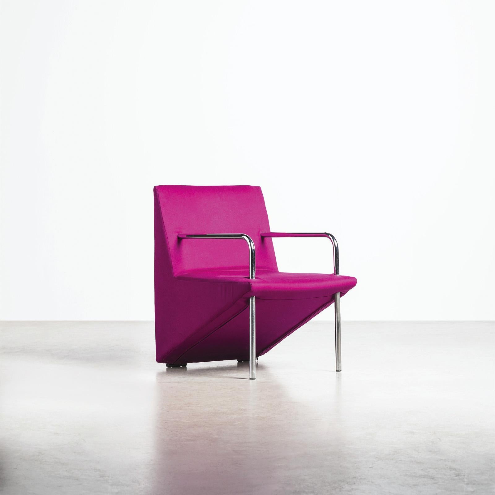Vote armchair designed by Giandomenico Bellotti and produced by Alias in 1980. The seat features a distinctive triangular structure, supported by the chair's two front legs made of tubular chrome-plated metal. The triangular frame serves as a back