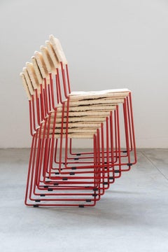 Red iron and natural straw alian dining chairs, hand woven