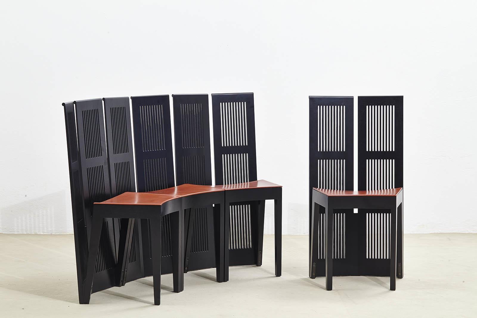 Lubekka chairs, designed by Andrea Branzi for Cassina in 1991, embody contemporary Italian aesthetics. Their distinctive design features a curved seat with a double backrest. The set comes with four chairs. The frame is made entirely of