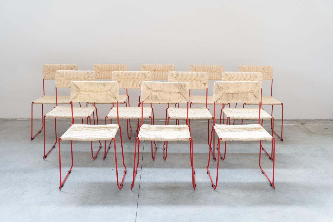 PIRELA ATELIER style chairs, nr 160, also sellable individually, 2000s
NEW chairs, still boxed, made of curved iron painted red. The seat and back are hand stuffed on the frame (paper straw) to ensure their great strength. They can be stacked up to