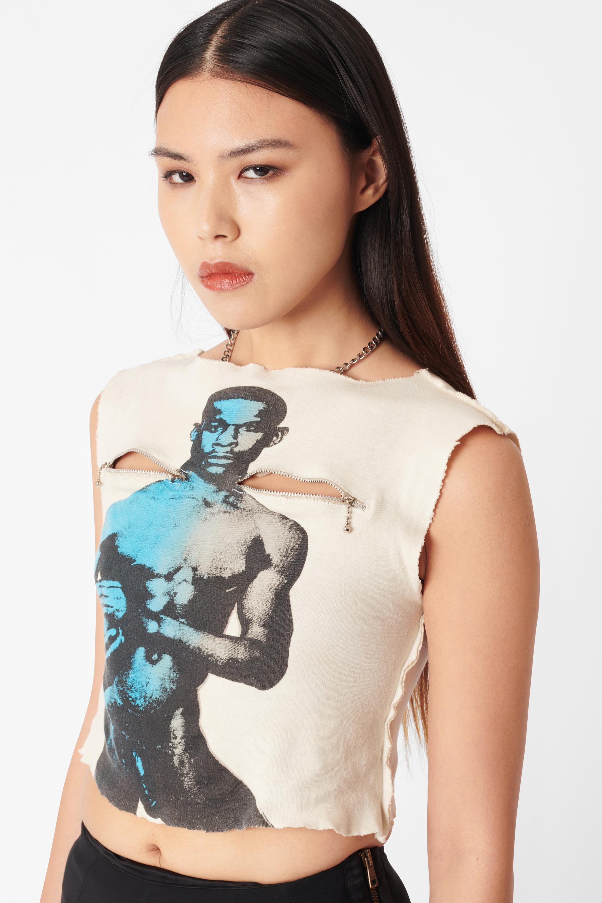 Vintage late 1970’s Vivienne Westwood x Malcolm Mclaren Seditionaries ‘A Naked Footballer’ t-shirt top. Features functional zips at upper chest, muscle tank silhouette and iconic print on front. In great vintage condition, some holes and tears in