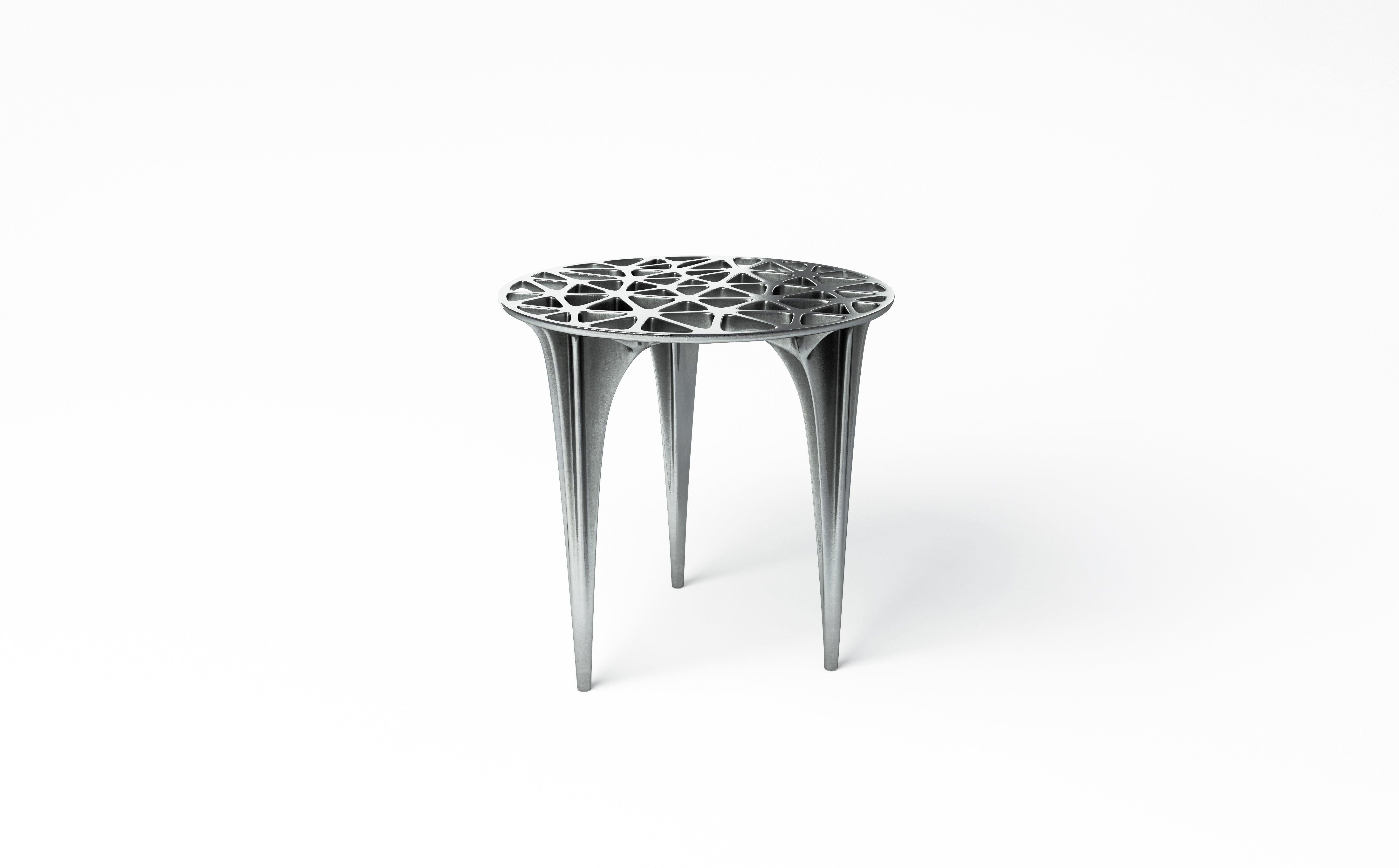 A polished aluminium side table inspired by the infamous red rocks of Sedona; the form references the peaks and plateaus of Sedona’s unique sandstone Formations. This design has a strong Silhouette and delicate, organic triangular detailing.

 