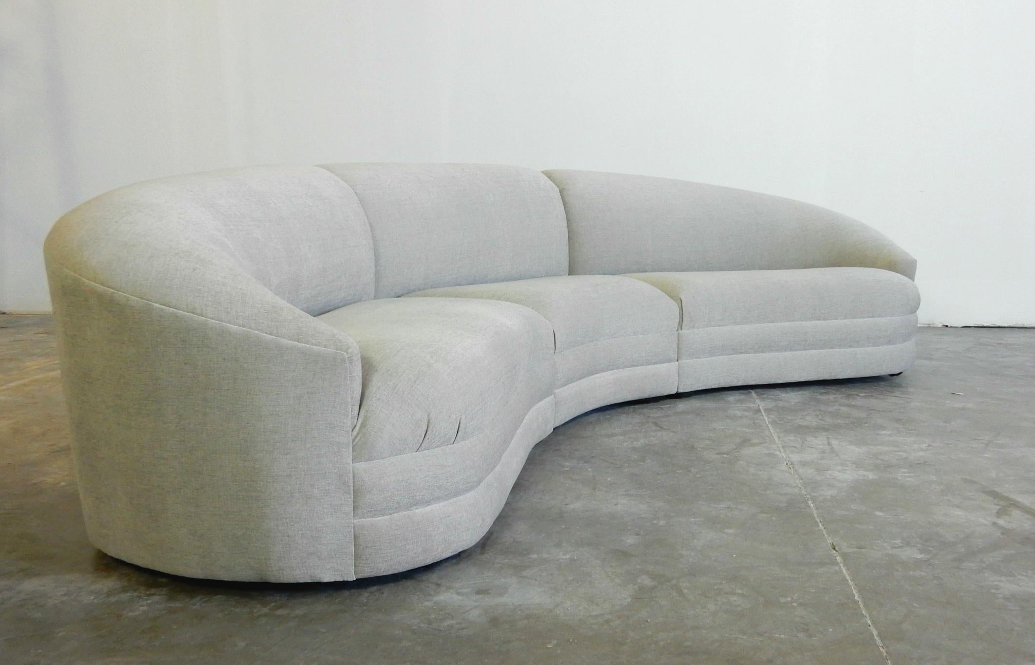 Newly upholstered and professionally restored 10 foot sectional sofa, circa 1980s.
Soft heather grey cotton fabric upholstery with premium foam. This sofa is very comfortable!
Separates into 3 sections. Floats on multiple steel glides
This sofa