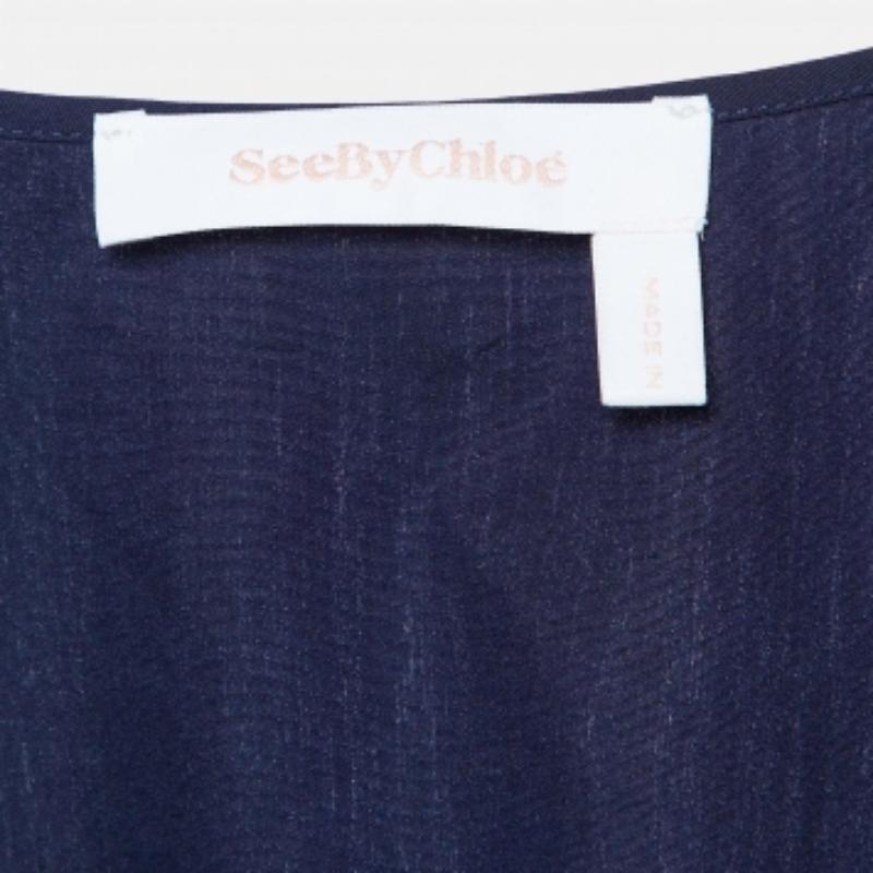 Questo top griffato offre stile e comfort. Realizzata con i migliori tessuti, la creazione è stata curata nei minimi dettagli. Abbinalo a un paio di jeans e a delle scarpe basse.