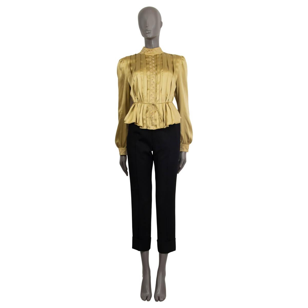 100% authentic See by Chloé pleated blouse in gold silk (81%) and cotton (19%). Embellished with embroideries on the collar, button tap and the cuffs. Comes with a satin waist band. The attacheable collar opens with two hooks and the shirt opens