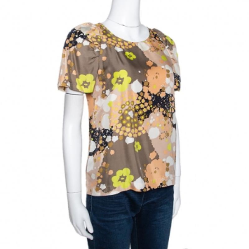 Avec ce haut See by Chloe, le confort et le style sont votre priorité. Célébrez la mode sans effort avec cette pièce à imprimé floral. Fabriqué de manière experte, ce haut à manches courtes vous permettra d'être aussi belle que vous vous sentez bien.
