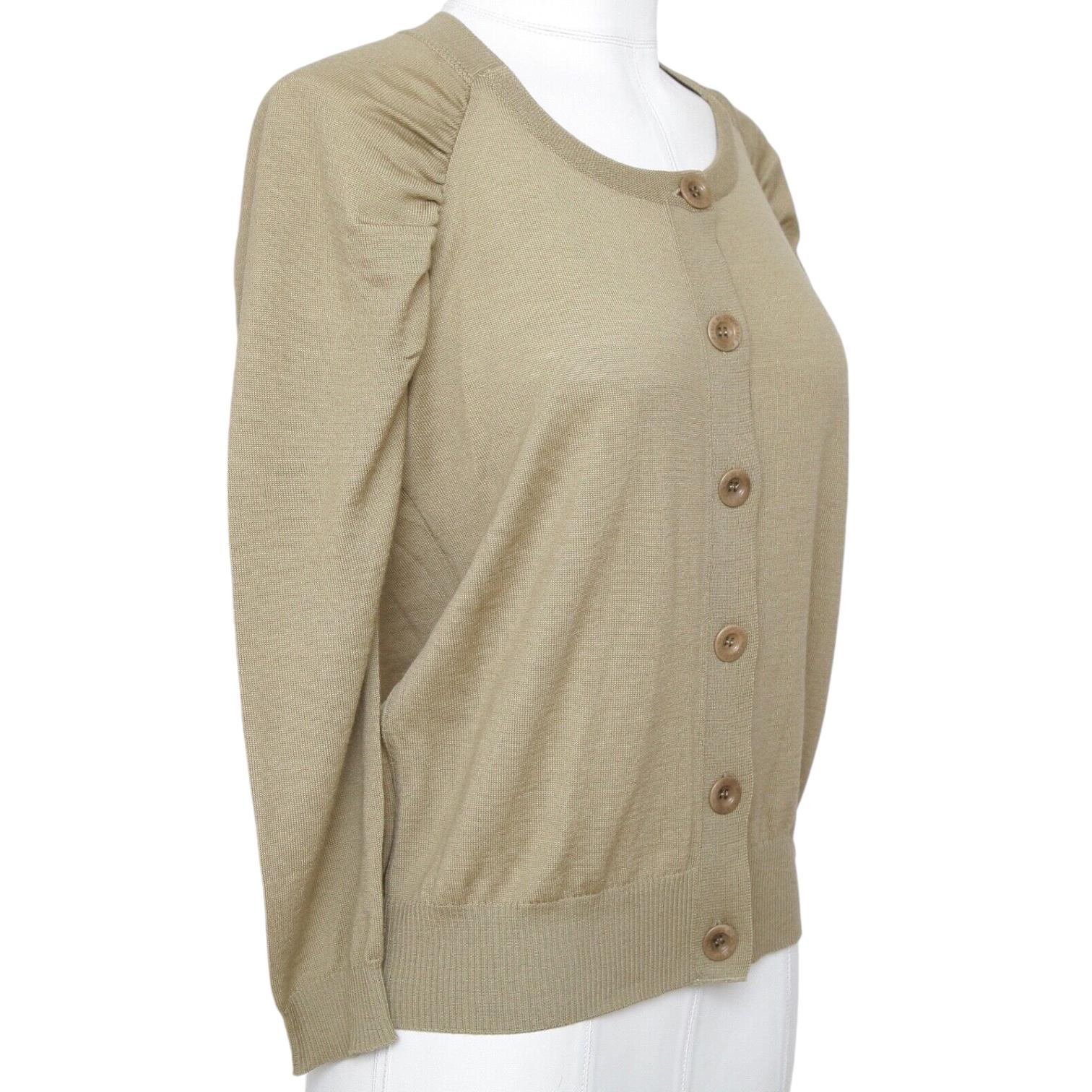 GUARANTEED AUTHENTIC SEE BY CHLOE 3/4 KNIT CARDIGAN

Details:
- Lightweight olive green knit cardigan.
- Button down front.
- Pleating at sleeve shoulders.
- Ribbing at neckline, cuffs and hem.
- 3/4 sleeve.
- See by Chloe charm by waistline.
-