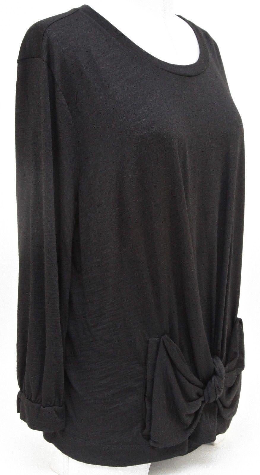 GUARANTEED AUTHENTIC SEE BY CHLOE 3/4 SLEEVE LENGTH BLACK SWEATER


Design:
 - 3/4 sleeve length black knit sweater in a classic black color.
 - Scoop neck.
 - Knot detail gathered at lower front of sweater.
 - Slip on, unlined.

Material: 60%