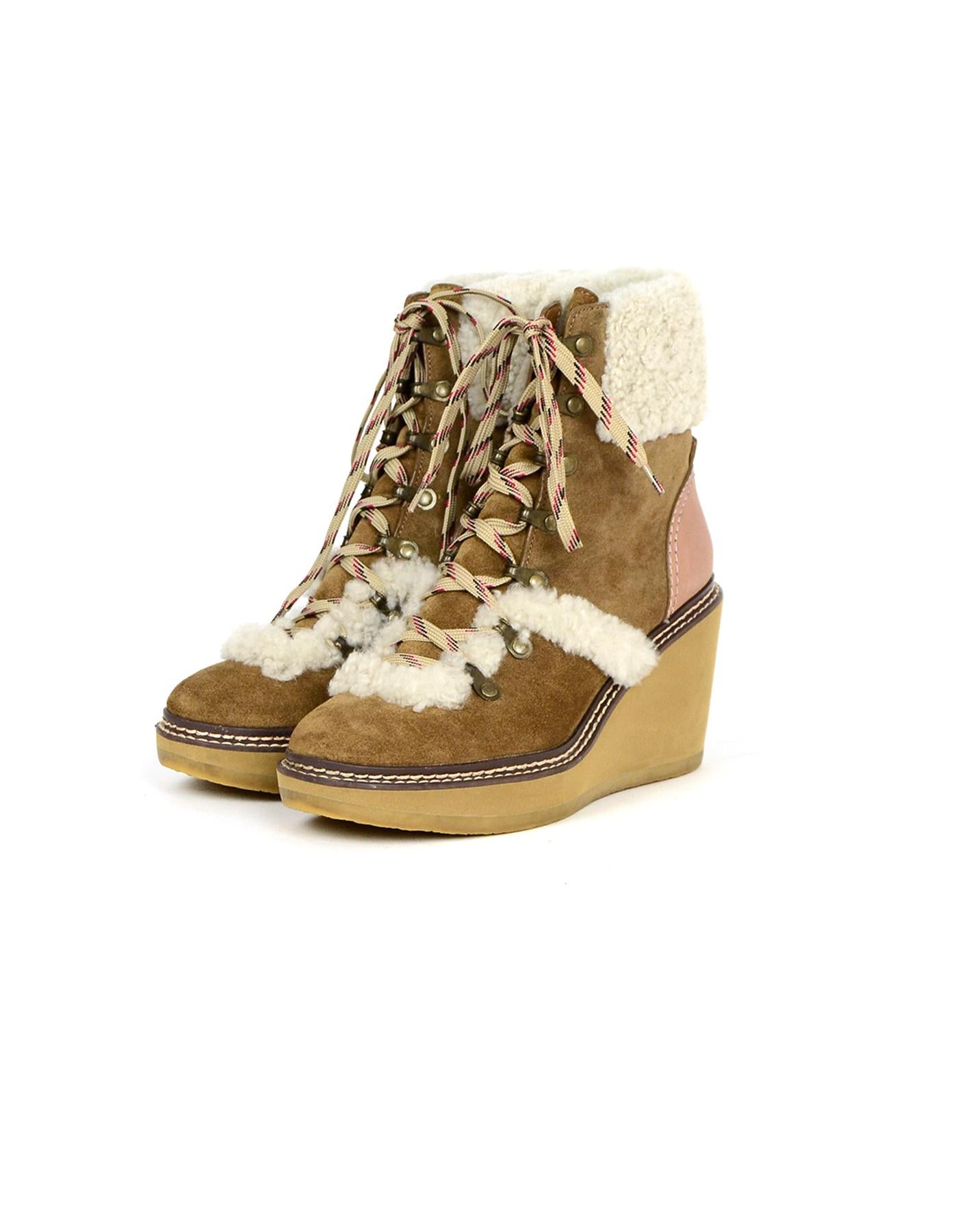 See By Chloe Tan Eileen Shearling-Lined Wedge Hiker Booties sz 39 rt $420

Color: Tan 
Hardware: Antique goldtone hardware
Materials: Leather, shearling lining
Closure/Opening: Lace-up
Overall Condition: Very good pre-owned condition, with small