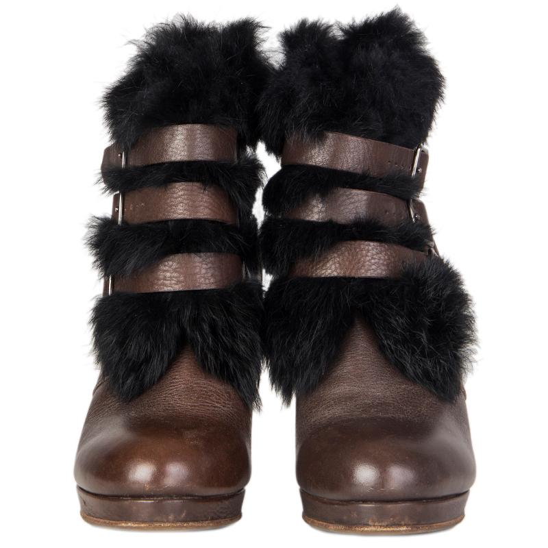 100% authentic See by Chloé ankle boots in brown leather with blck rabbit fur around the ankle an dbuckles. Inside is unlined. Open with three strap on the front. Have been worn and are in excellent condition. Rubber sole got added.