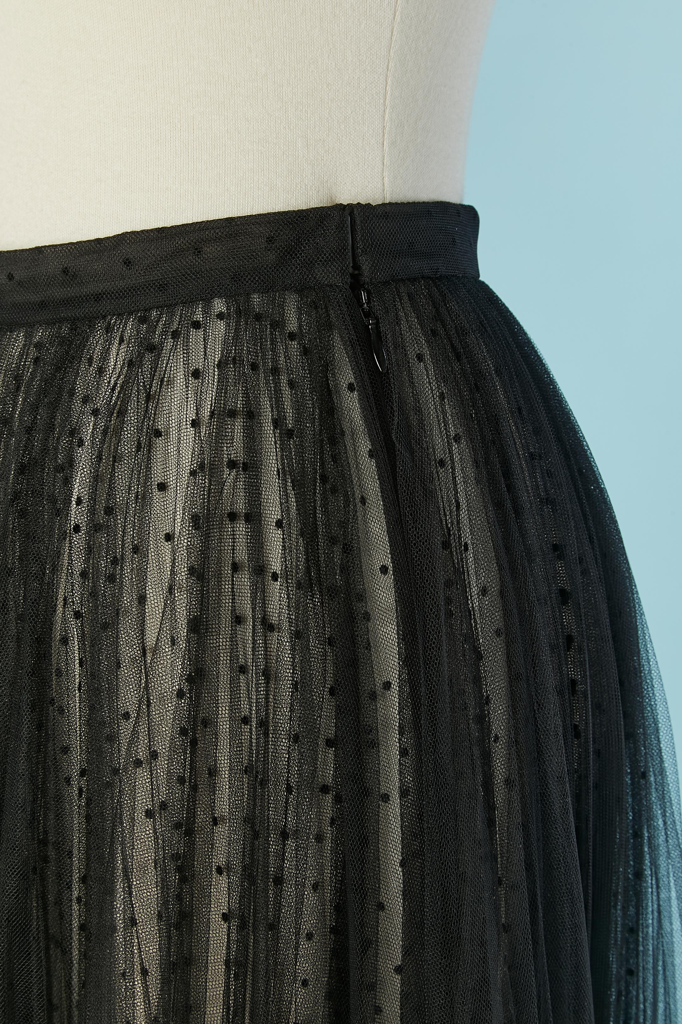 See-through pleated plumetis tulle skirt. 2 lays of tulle. 
Zip and hook&eye closure on the left side. 
SIZE 34 / XS 