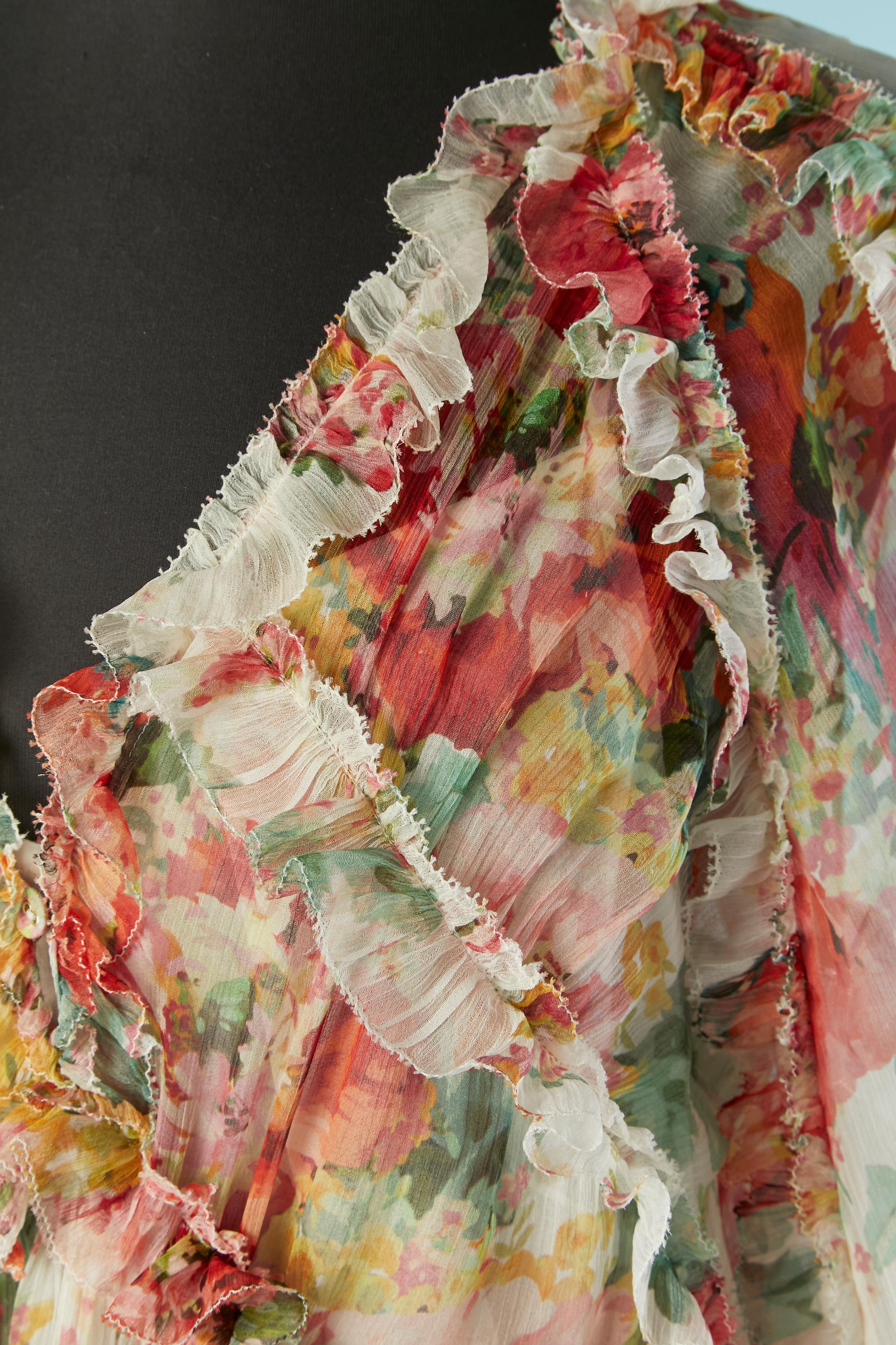 Bedrucktes Seidenchiffon-Cocktailkleid mit Rüschen. Weißes Unterkleid aus Bio-Baumwolle mit verstellbarem Schulterriemen. 
3 Stoffknöpfe und Knopfloch in der oberen vorderen Mitte des Kleides.
Kleid GRÖSSE : L 
Slipdress GRÖSSE : M 
