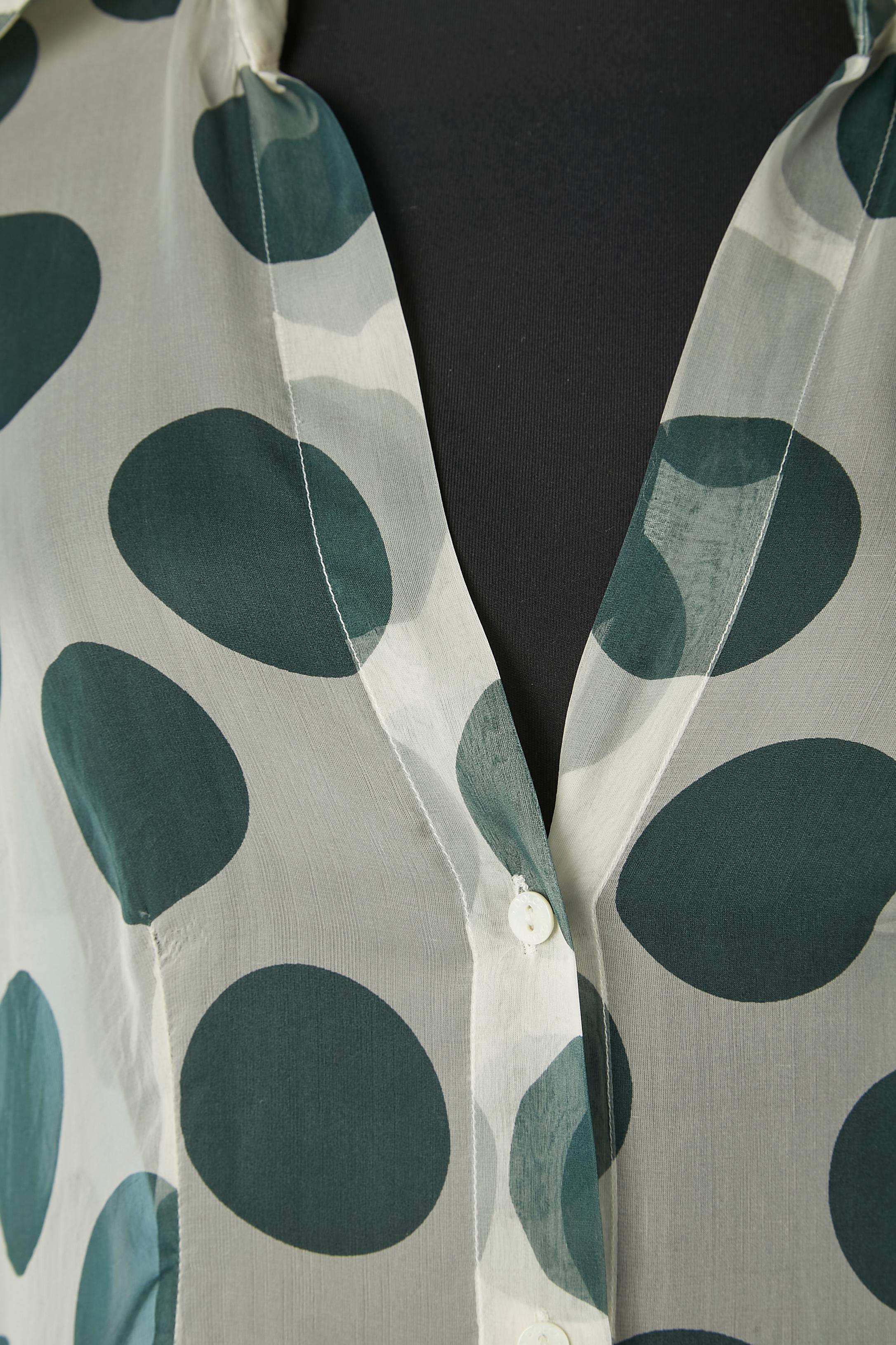 See-through silk chiffon shirt with green Polka dots print. Branded mother-of-shell buttons in the middle front and rhinestone cuff links. 
SIZE 44 (It) 40 (Fr) 10 (Us) 