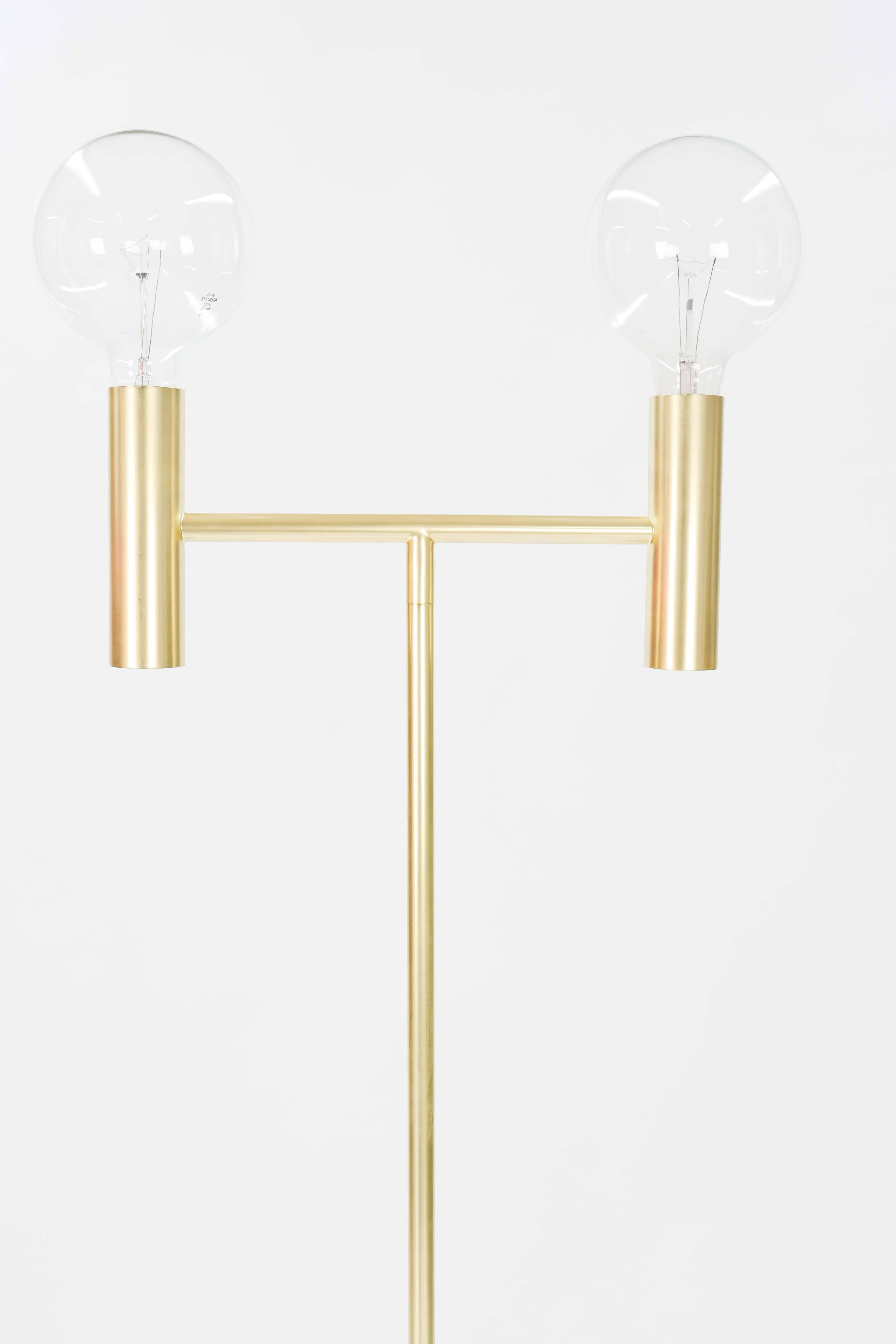 Seed design of Denmark brass double head floor lamp.