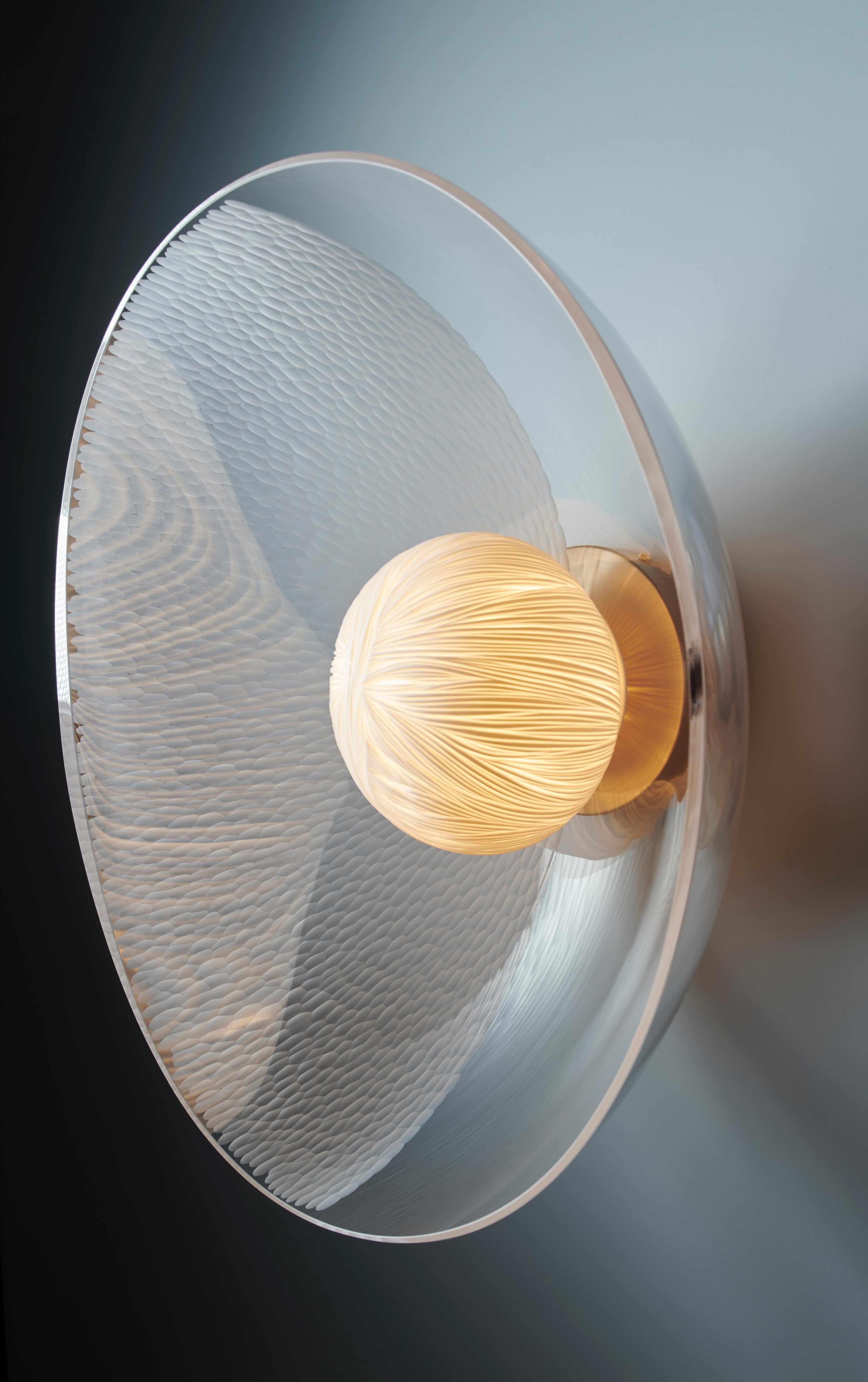 Seed light by Vezzini & Chen
Dimensions: W41cm X D36cm X H17cm
Materials: Furnace Glass, Porcelain, 7w G9 Dimmable Warm white LED, brushed brass fitting, 2 Core double insulated electric cable + Earth.
Also Available: Glass is engraved with