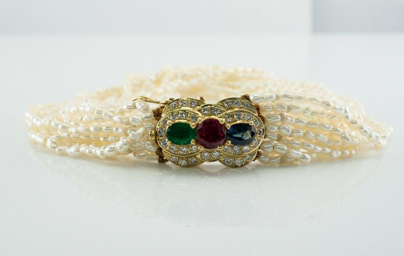 This pretty vintage bracelet is set with natural freshwater seed pearls with a solid 14K Yellow gold clasp. The clasp holds Natural Earth-mined Ruby in the center (5mm x 3.8mm = .40 carat), emerald and sapphire measuring 4mm x 3mm = .50 total for