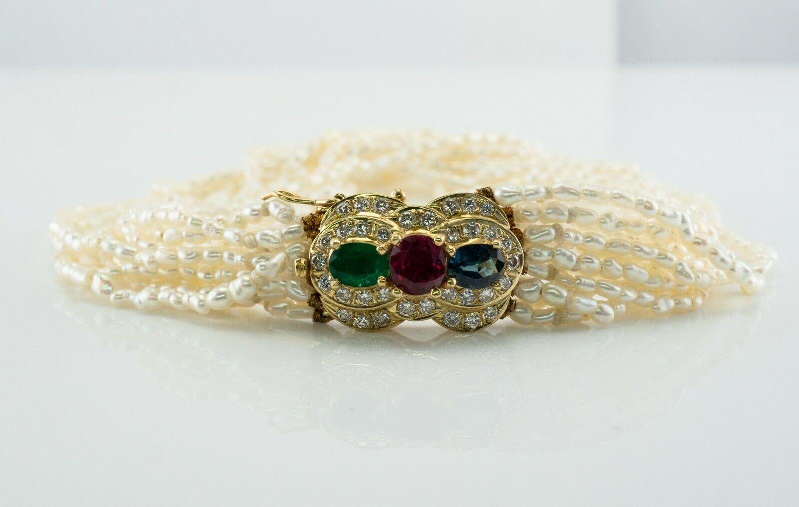 Bracciale con perle e rubini e zaffiri Smeraldo e diamanti in oro 14K

Questo grazioso braccialetto vintage è incastonato con perle d'acqua dolce naturali e chiusura in oro giallo 14K. 
La chiusura contiene un rubino naturale estratto dalla terra al