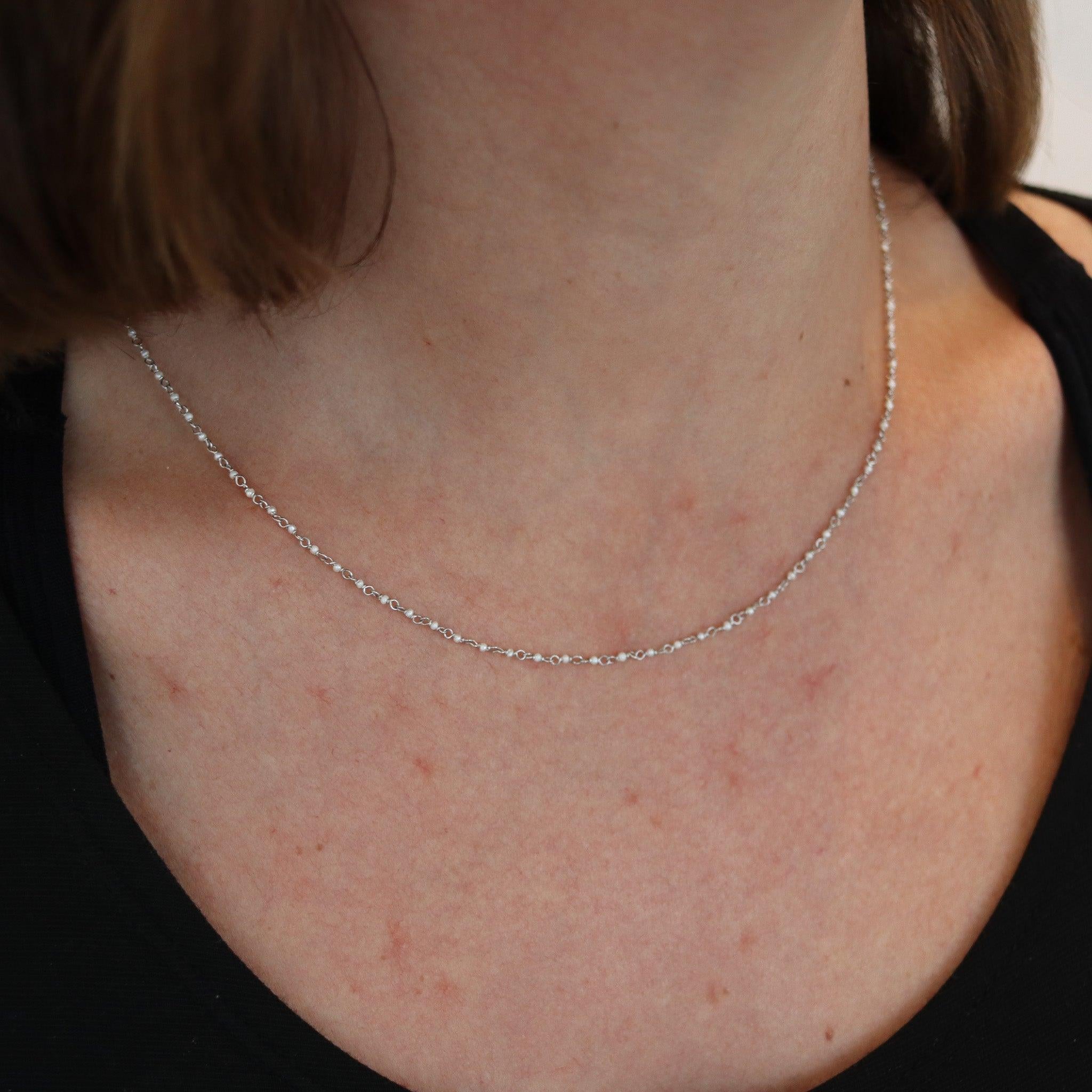 An art deco necklace chain with seed pearls.

This is a very delicate necklace chain, created in America during the art deco period, back in the 1920's. The chain has been carefully crafted with thin twisted wires made up in platinum and mounted