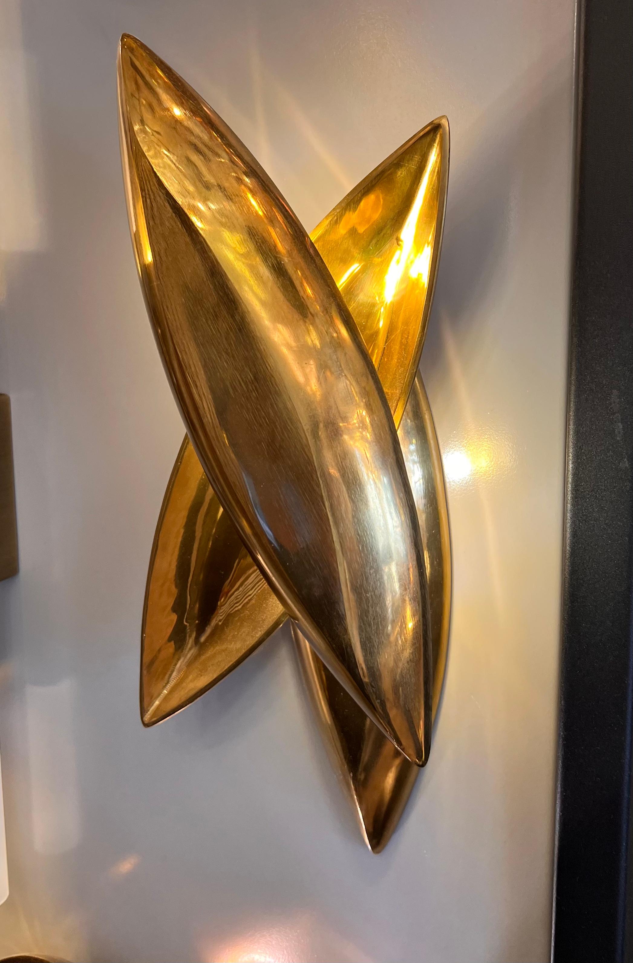 SEED wall sconce is a stunning piece of lighting that is crafted from three pieces of brass casting, inspired by the organic form of a seed. The overall design is a beautiful representation of nature and features intricate details that are both