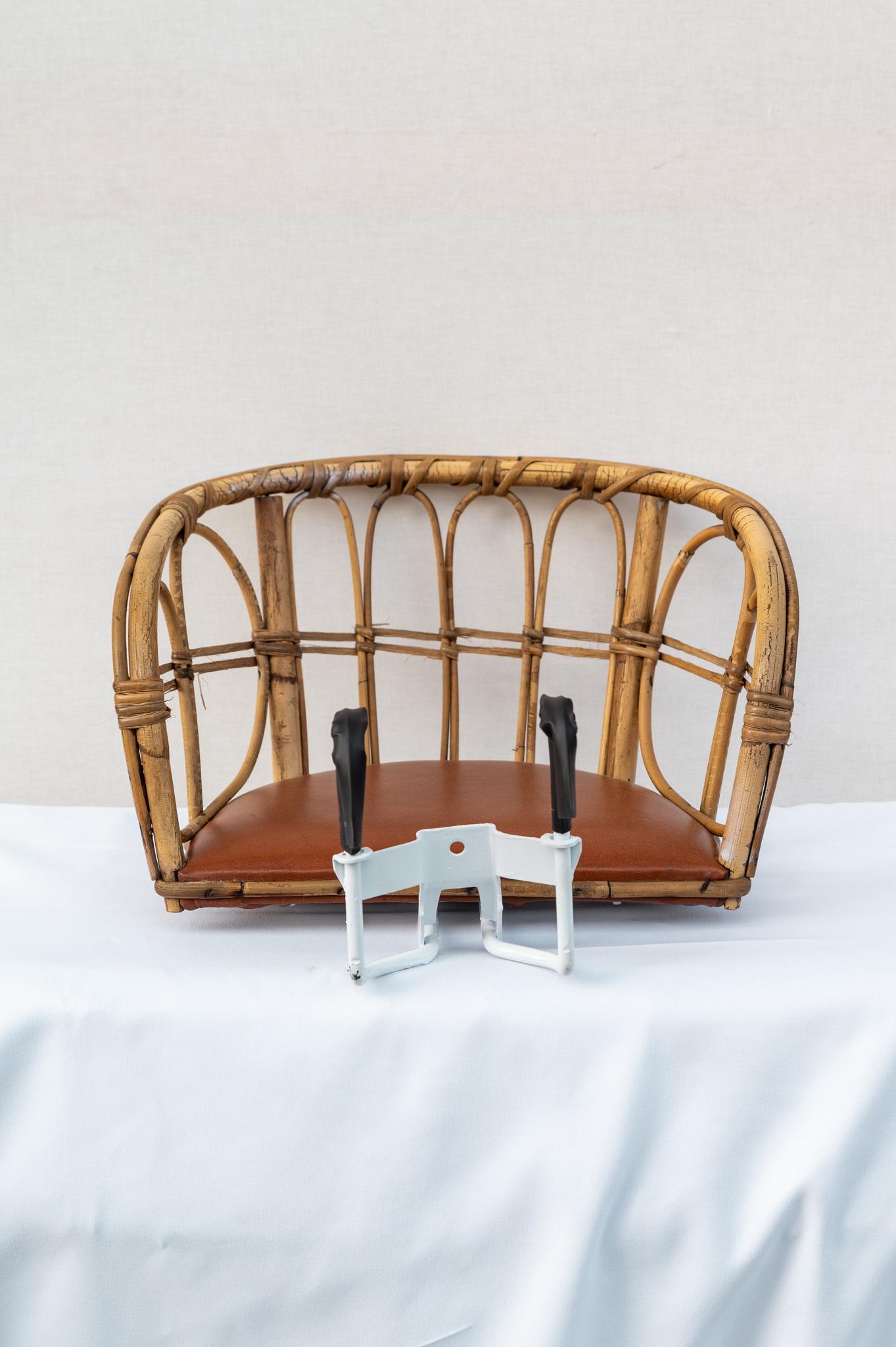 Wicker front seat for carrying babies, Made in Italy, 1960s . 
Rare wicker front seat for carrying children for bicycles from the 1960s period. 
It is in perfect condition but being of the period does not meet current standards. 
The price of
