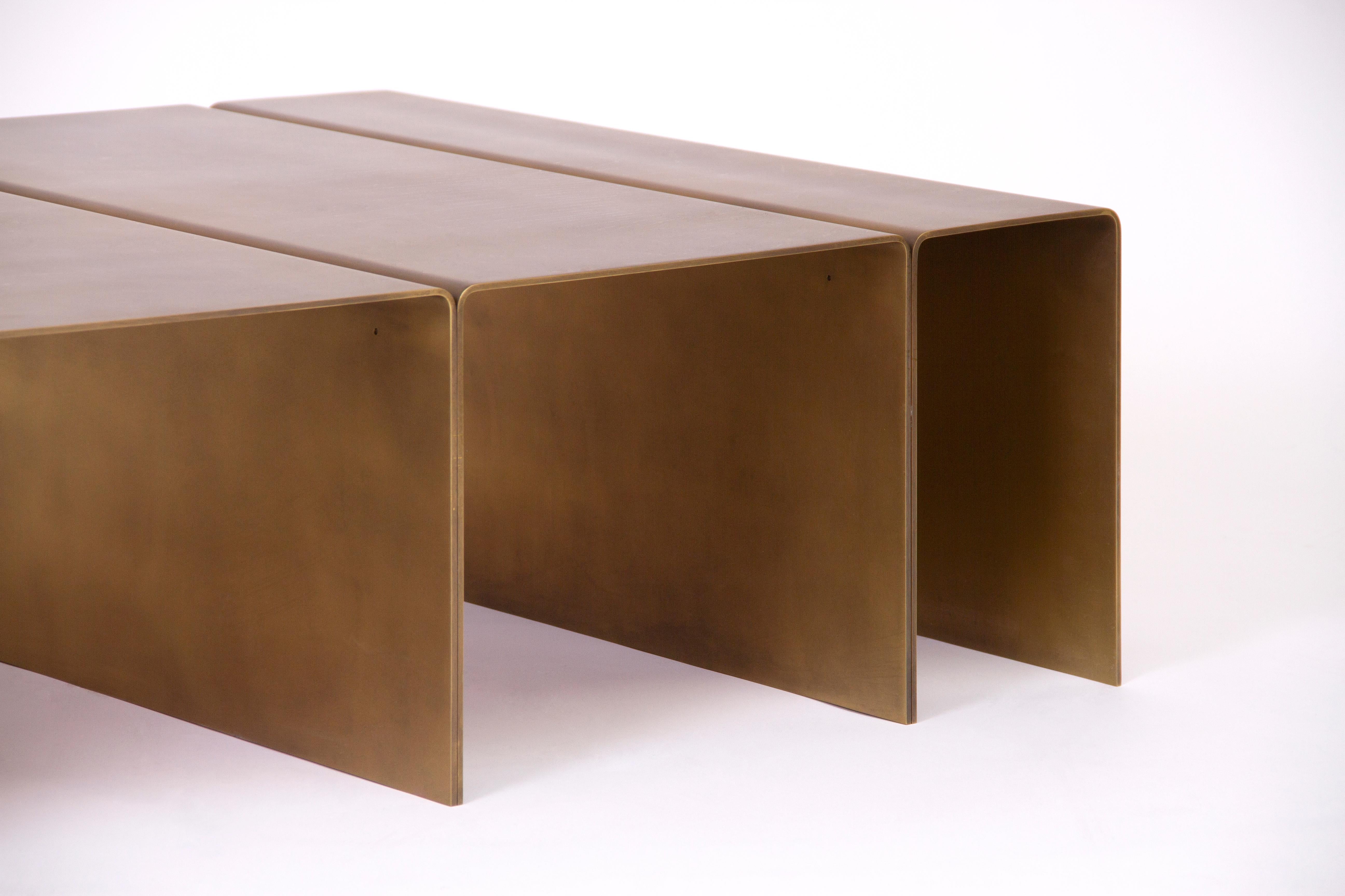 Contemporary coffee table made from solid brass in a burnished finish. 
Sealed with a clear protective coating.

Also available in brushed aluminum and blackened steel.

Designed and made by hand in Los Angeles, California.