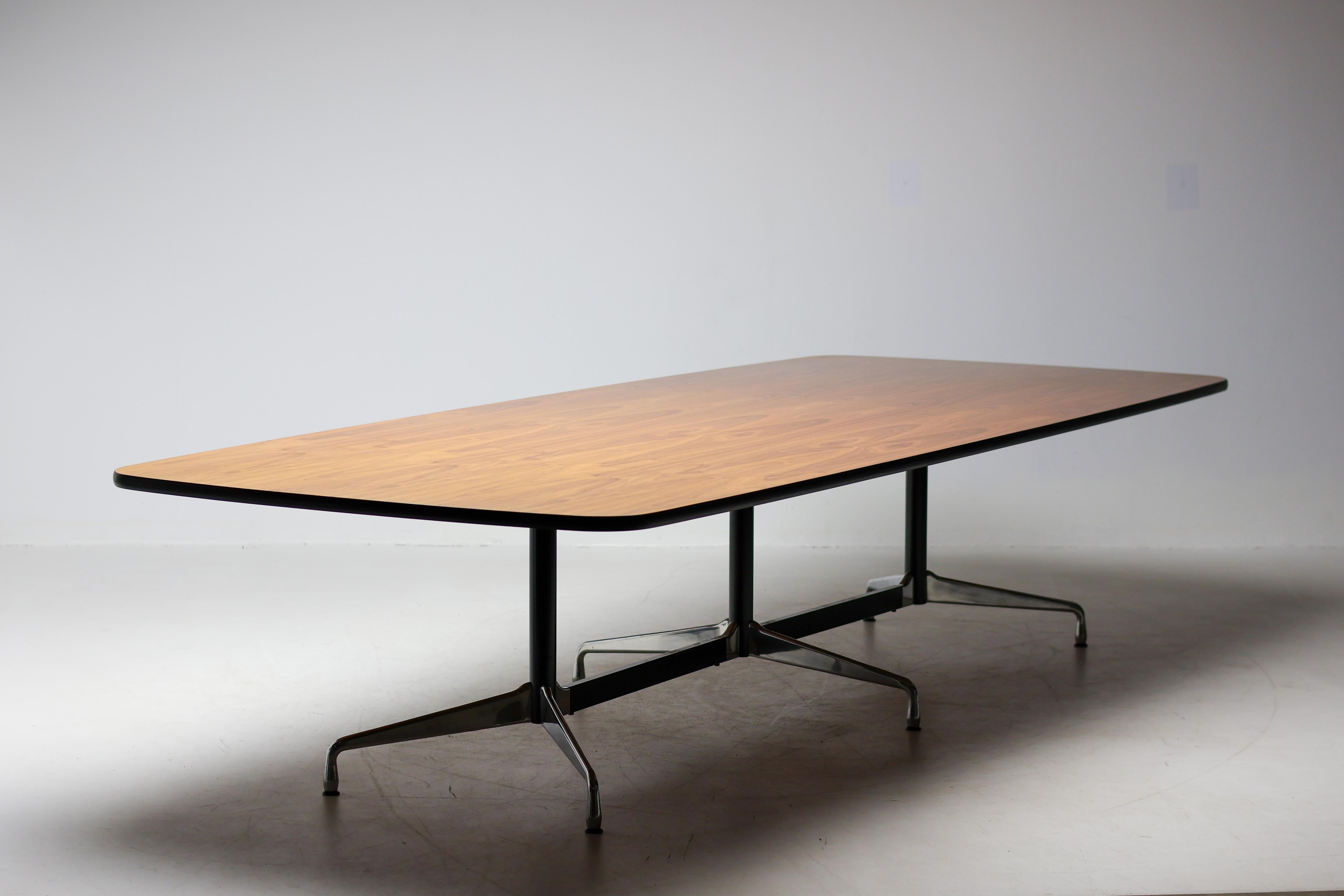 Very large Charles & Ray Eames Segmented Base conference table made by Vitra in 2007.
Custom order walnut book matched veneer one piece tabletop.
Marked with Vitra label.
Used until recently in the boardroom of a real estate agent in Amsterdam.
Very