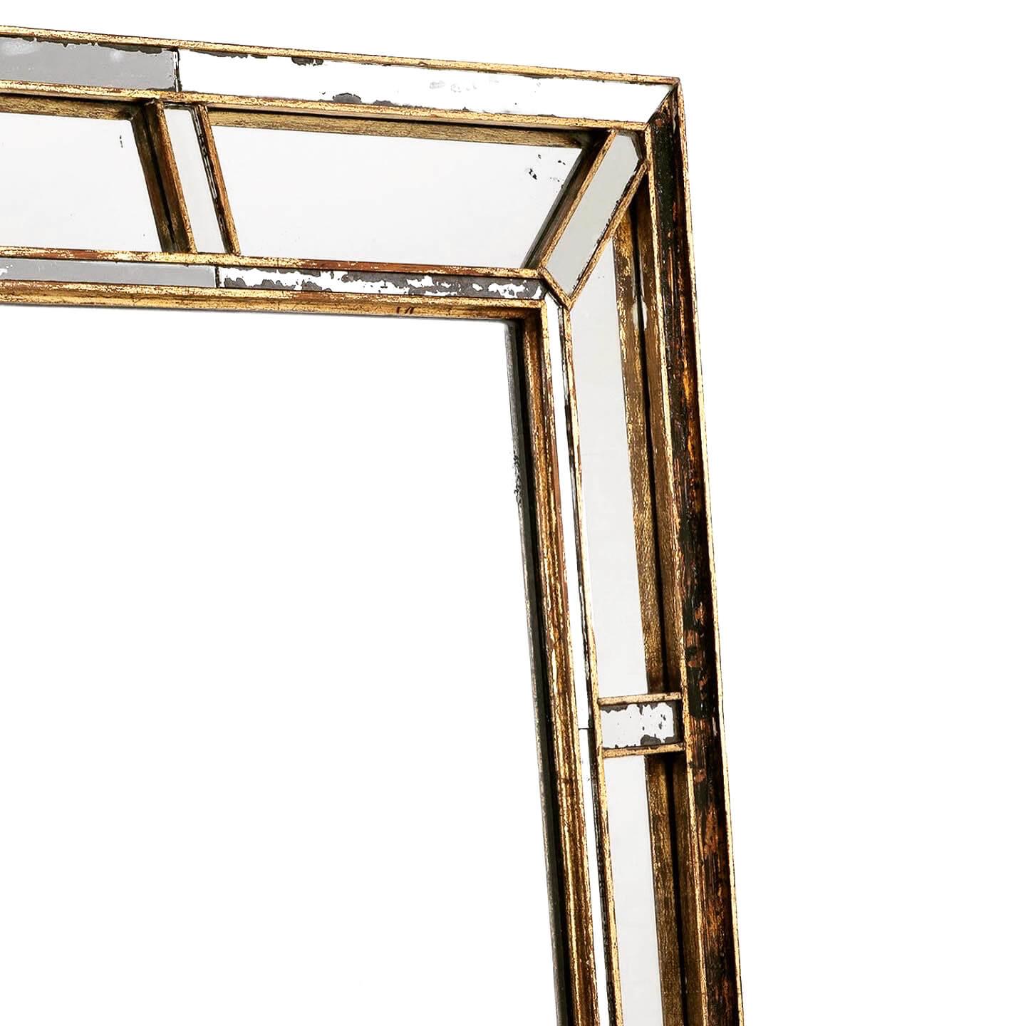 A charming 20th Century segmented cushion mirror. 

The black and gold gilt-edged frame highlights the foxed glass, complimenting its unique design. 

English, circa 1910.