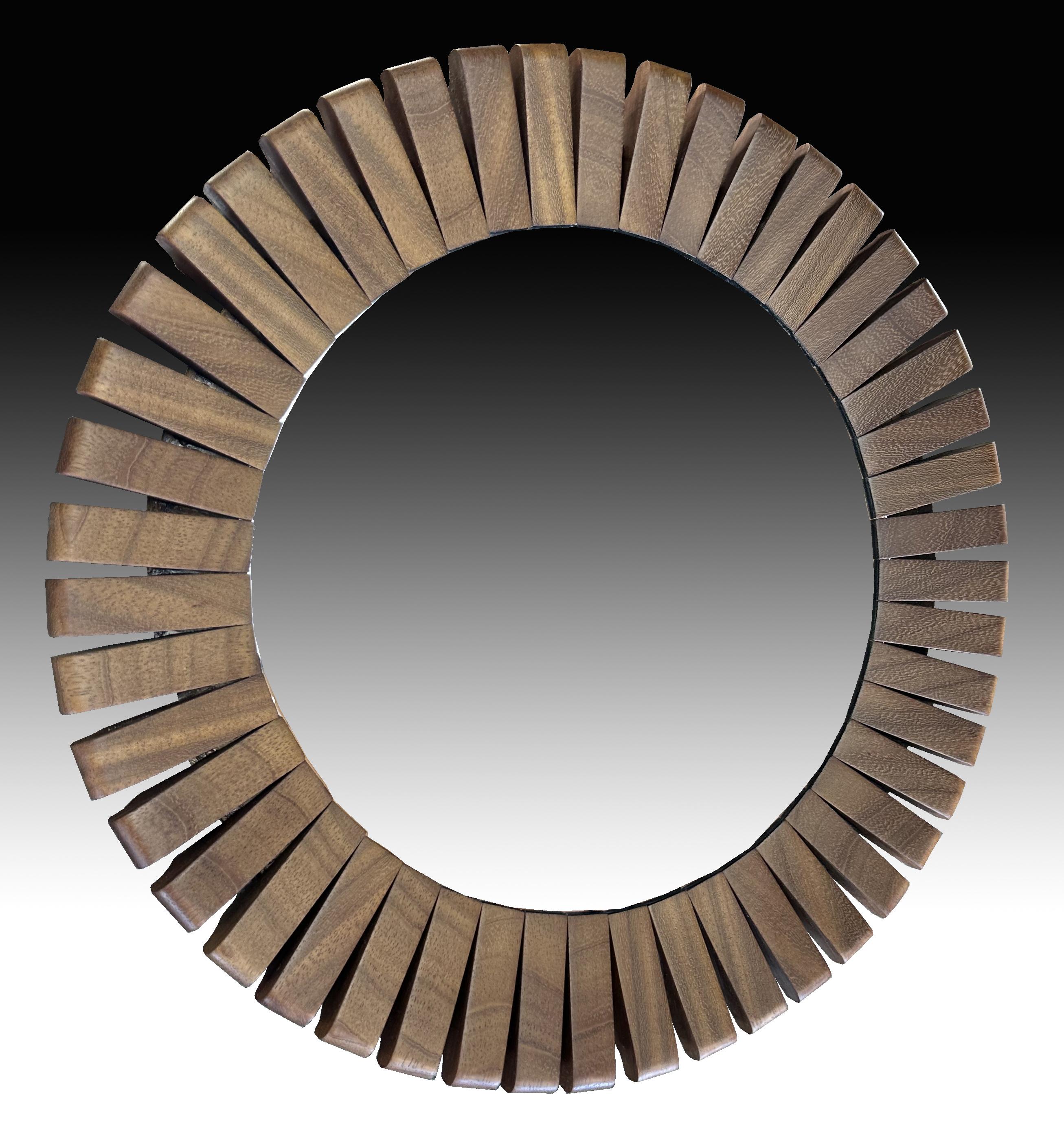A really nice segmented frame circular mirror, the whole in very good condition with no blemishes on either mirror glass or frame.
theactual mirror glass is 38cm diameter and the frame 56 cm overall.