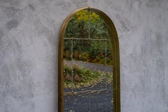 Segmented Mirror by Jordan Hufnagel with arched brass frame