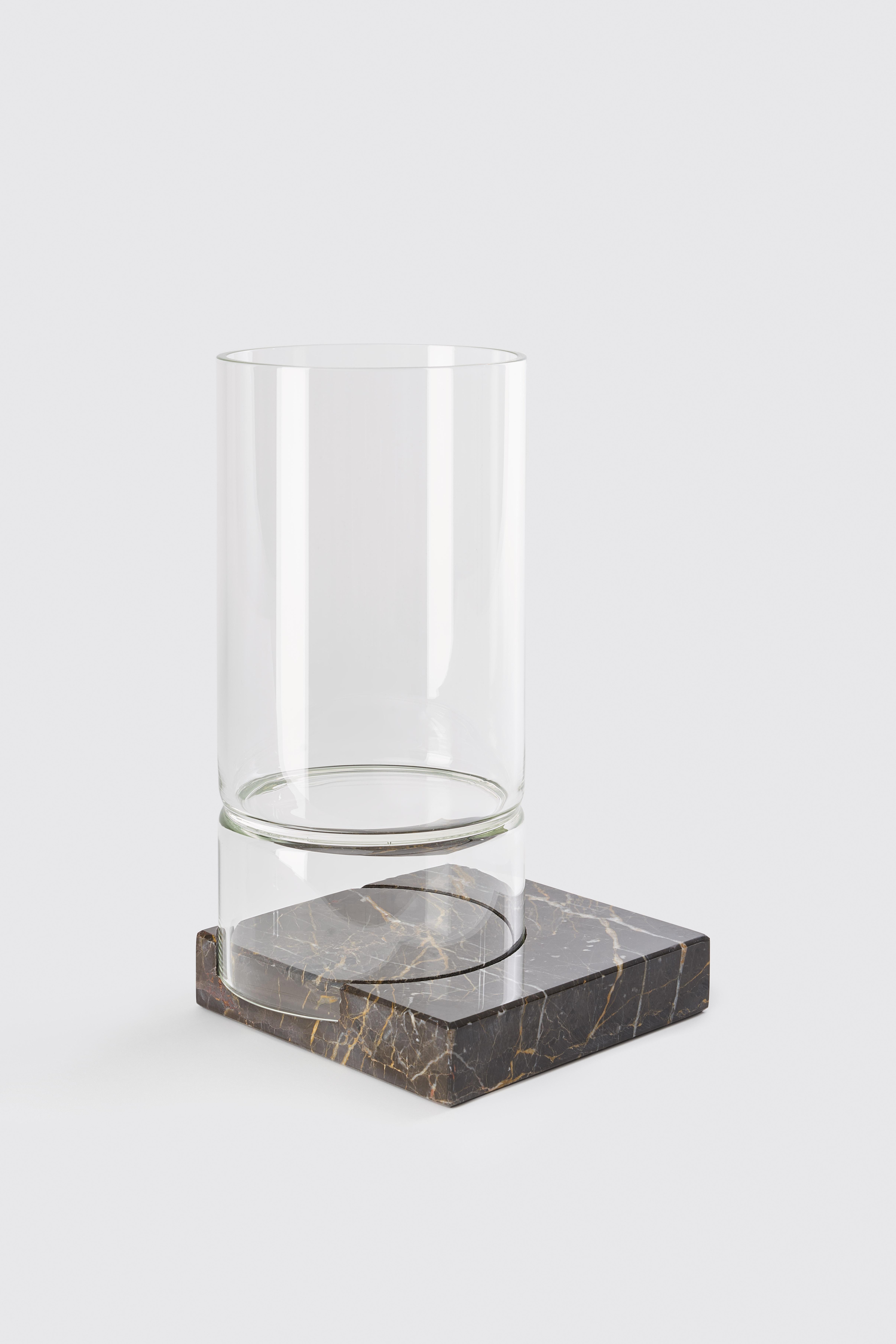 Segno vase II - Giorgio Bonaguro
Dimensions: D 18 x W 18 x H 15 cm.
Materials: emperador dark marble, glass.

A collection that was born from the desire to recover marble processing waste: small portions of slabs with different thickness,