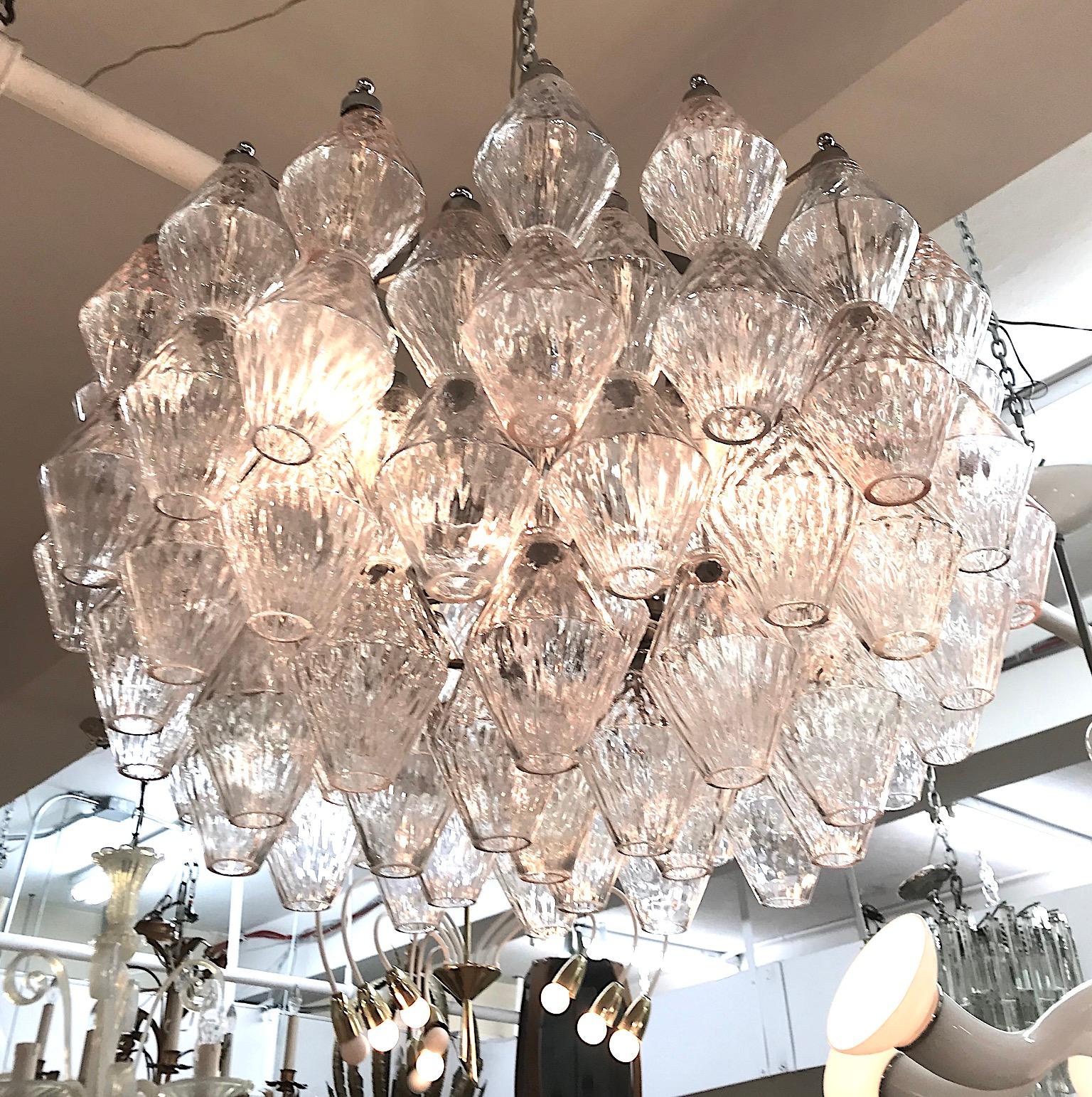 A lovely and rare model Seguso of Italy 1960s chandelier made in Murano, Italy. The large glass pieces are hand blown glass with a light diamond patter in a clear and blush color. Body of chandelier measures 25