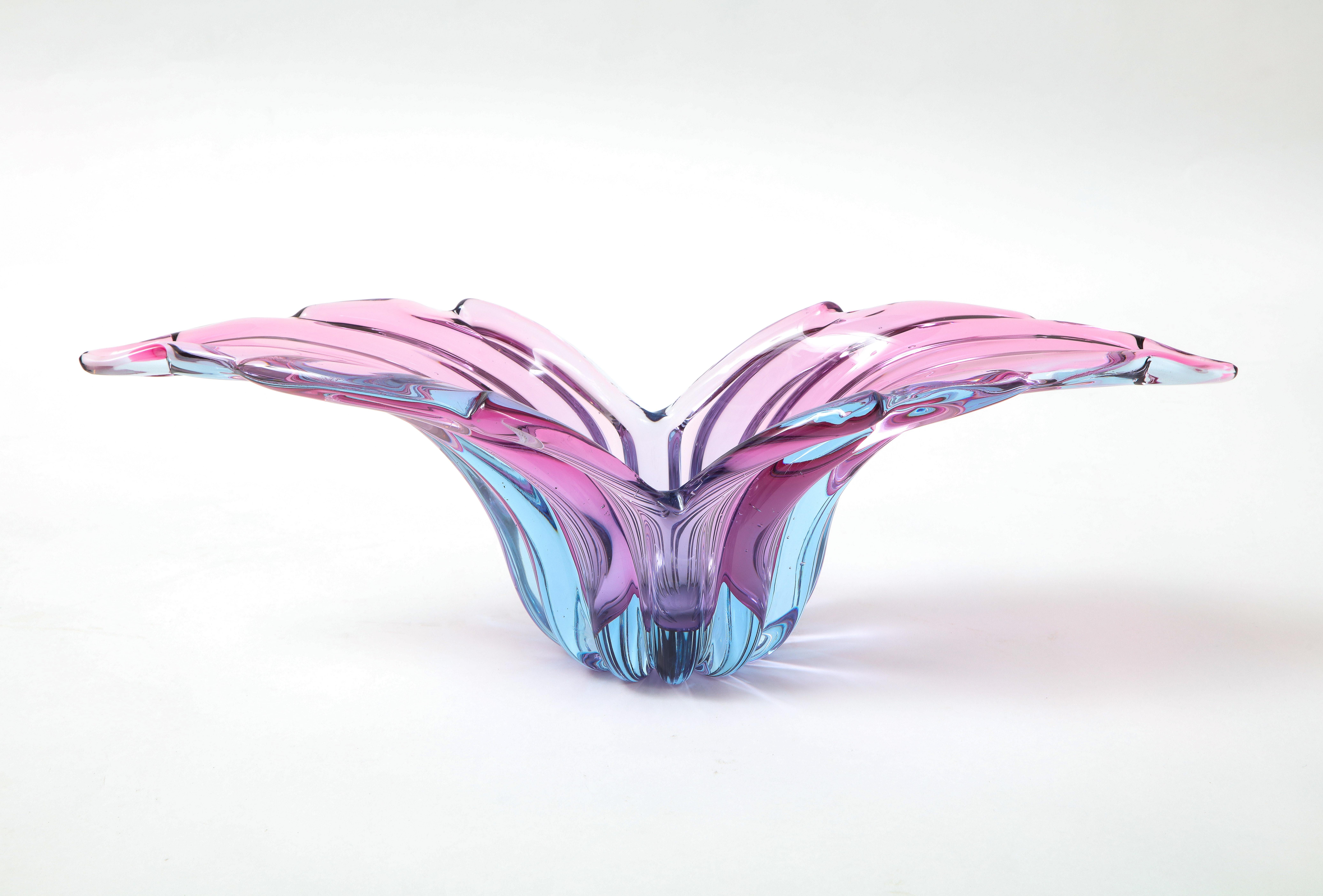 Murano art glass vessel showcasing a gored body and an ombre effect of purples and magenta.