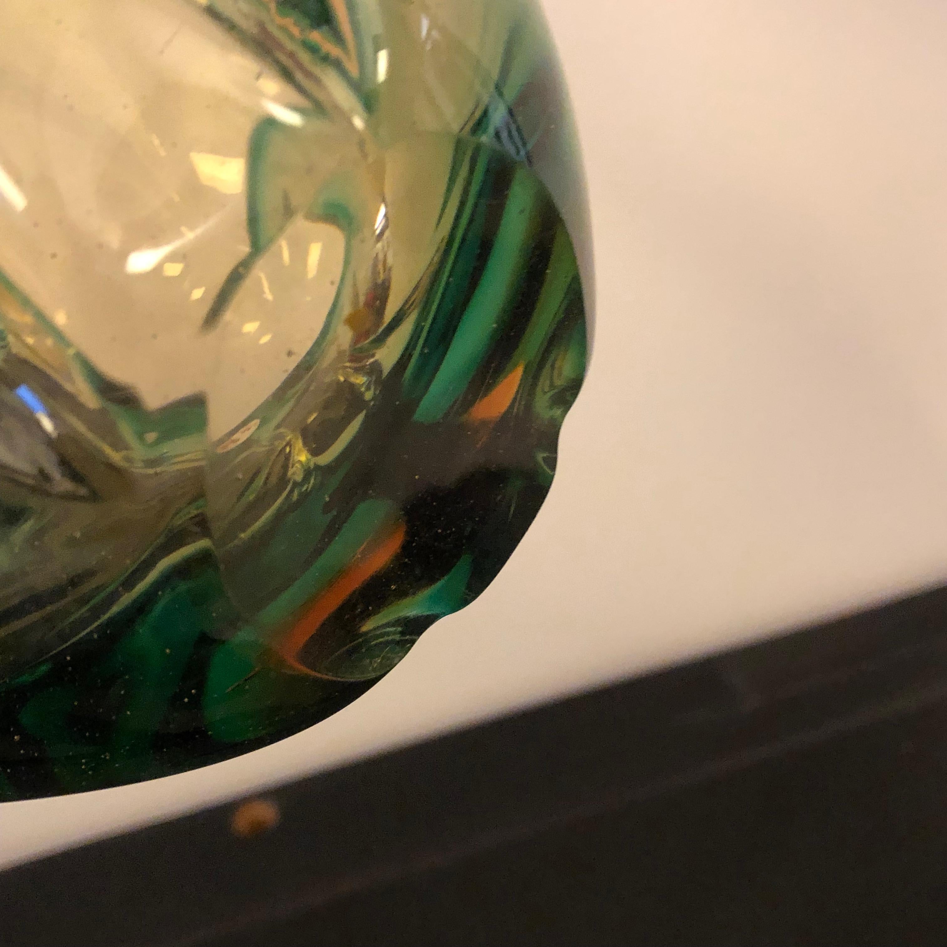 A Particular Sommerso Murano glass centerpiece designed and hand-crafted in Venice in the 1960s, item is in perfect conditions. The green and brown colors have been made with the Sommerso glass technique. 