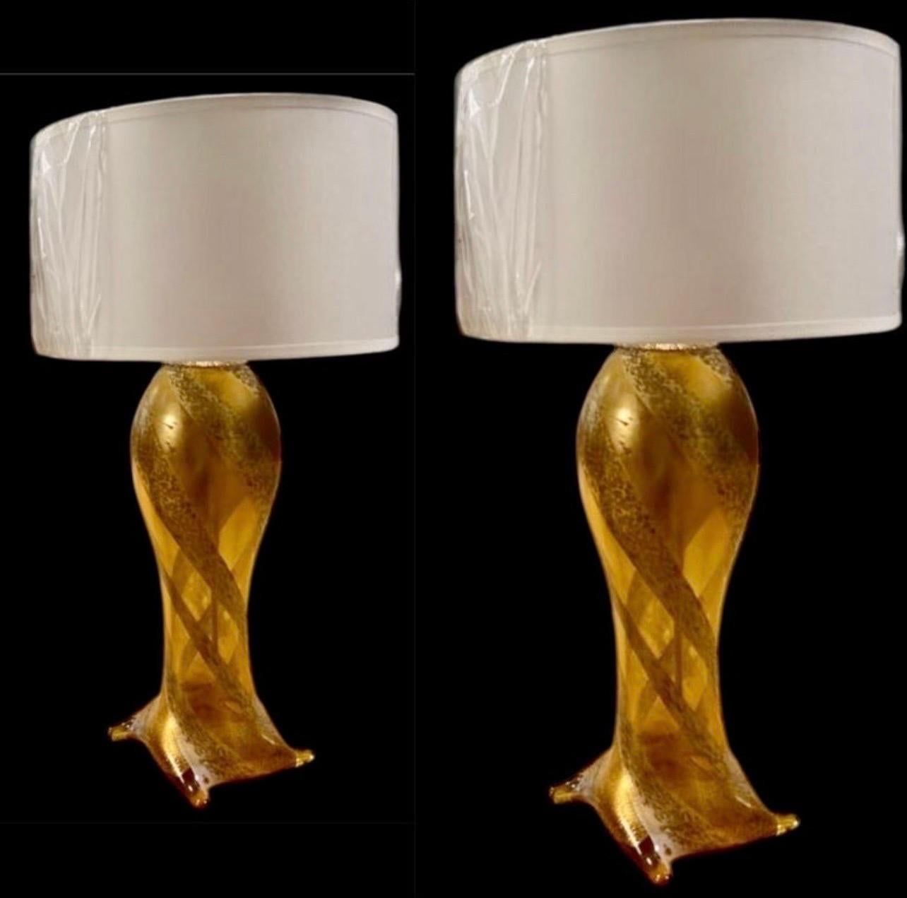 Pair of table lamp Murano art glass sculptural vase in gold inlaid. 
Doesn't include Lampshade
manufactured by Seguso Vetri d'Arte by Flavio Poli . Italy, 1950s. Brilliant colors: Gold glass inlaid in clear glass using the Sommerso technique.