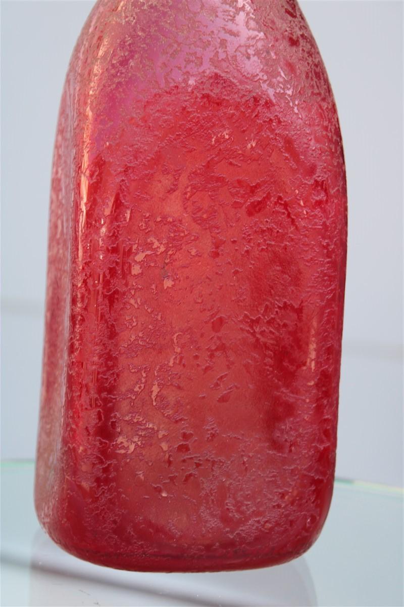 Seguso corroded cobalt red vase in the shape of a bottle, 1960s.