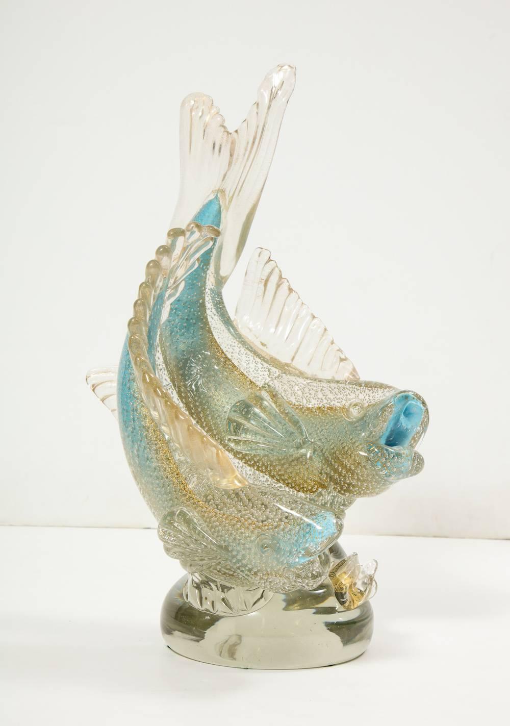 Bullicante fish sculpture by Flavio Poli for Seguso.
Fantastic example of Seguso's bullicante figures from the late 1930s. Pale blue and clear glass with internal bubbles. Two fish in motion mounted to an organic mound. Unsigned.