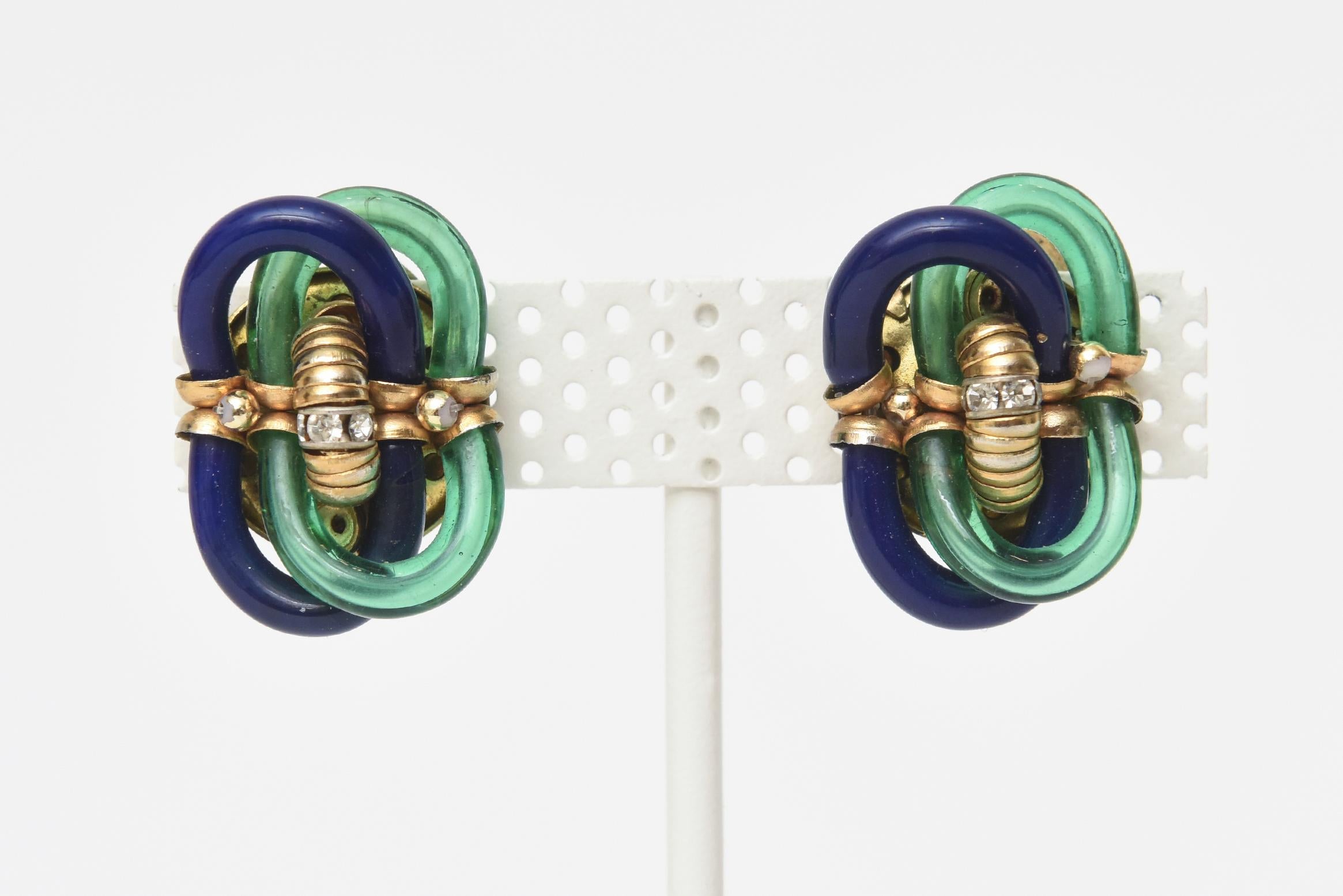 This lovely pair of very early vintage clip on Chanel earrings are the dual collaboration of the Italian master glass artist: Seguso and Chanel. They are very early from the 50's or 60's. The luminous twisted blue and green glass is set against