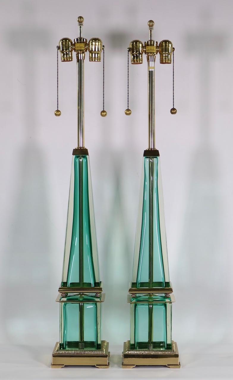 Italian Hollywood Regency pair of Murano glass obelisk lamps made by Seguso for Marbro Lamp Company. The pair is made in Sommerso glass with green turquoise color and has been completely restored with new wiring and clean brass. In excellent vintage
