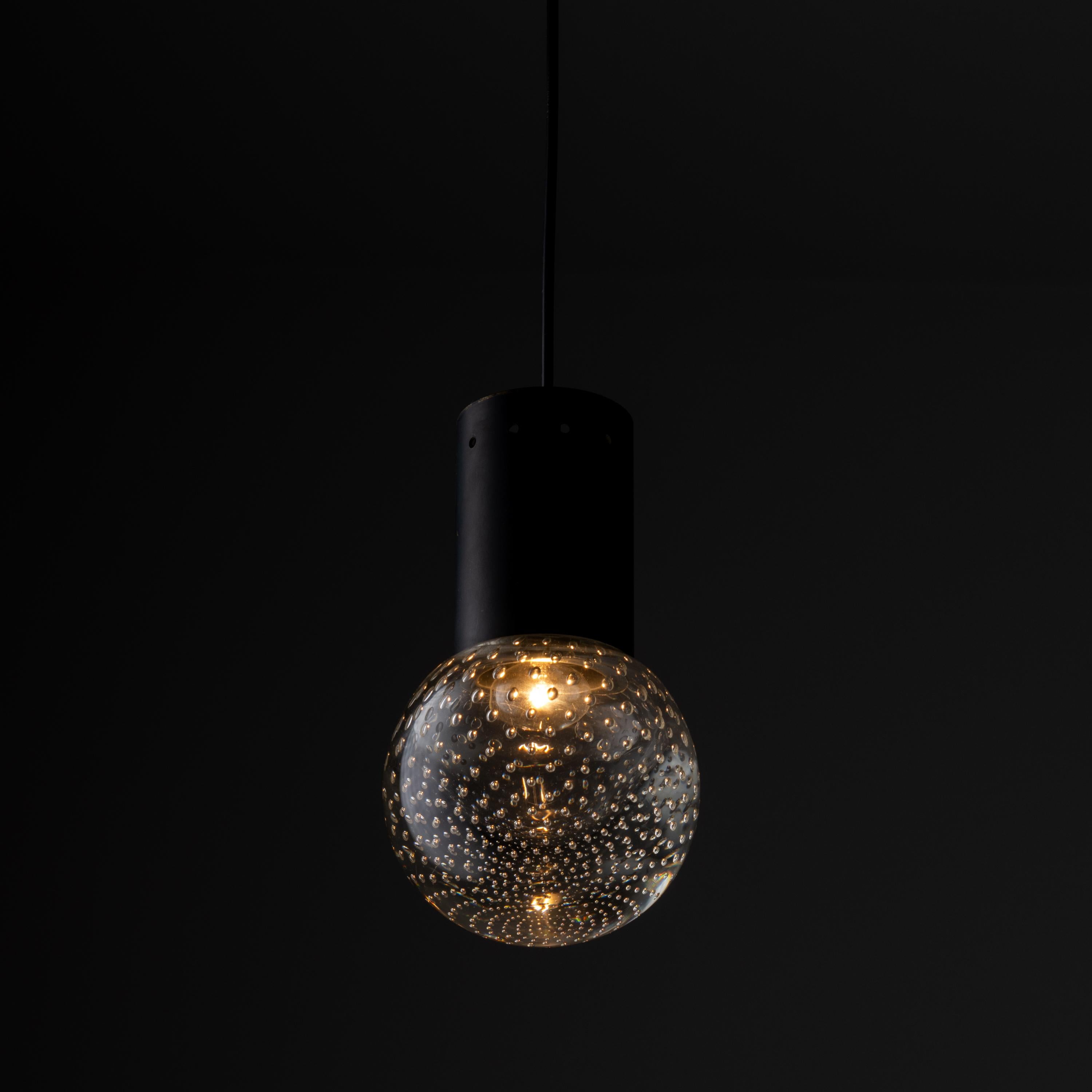 Seguso Glass Pendants by Gino Sarfatti for Arteluce. Designed and manufactured in Italy, circa the 1960s. Executed in hand blown bubbled Seguso glass and painted metal. This simple design, focuses on the striking glass once illuminated, allowing for
