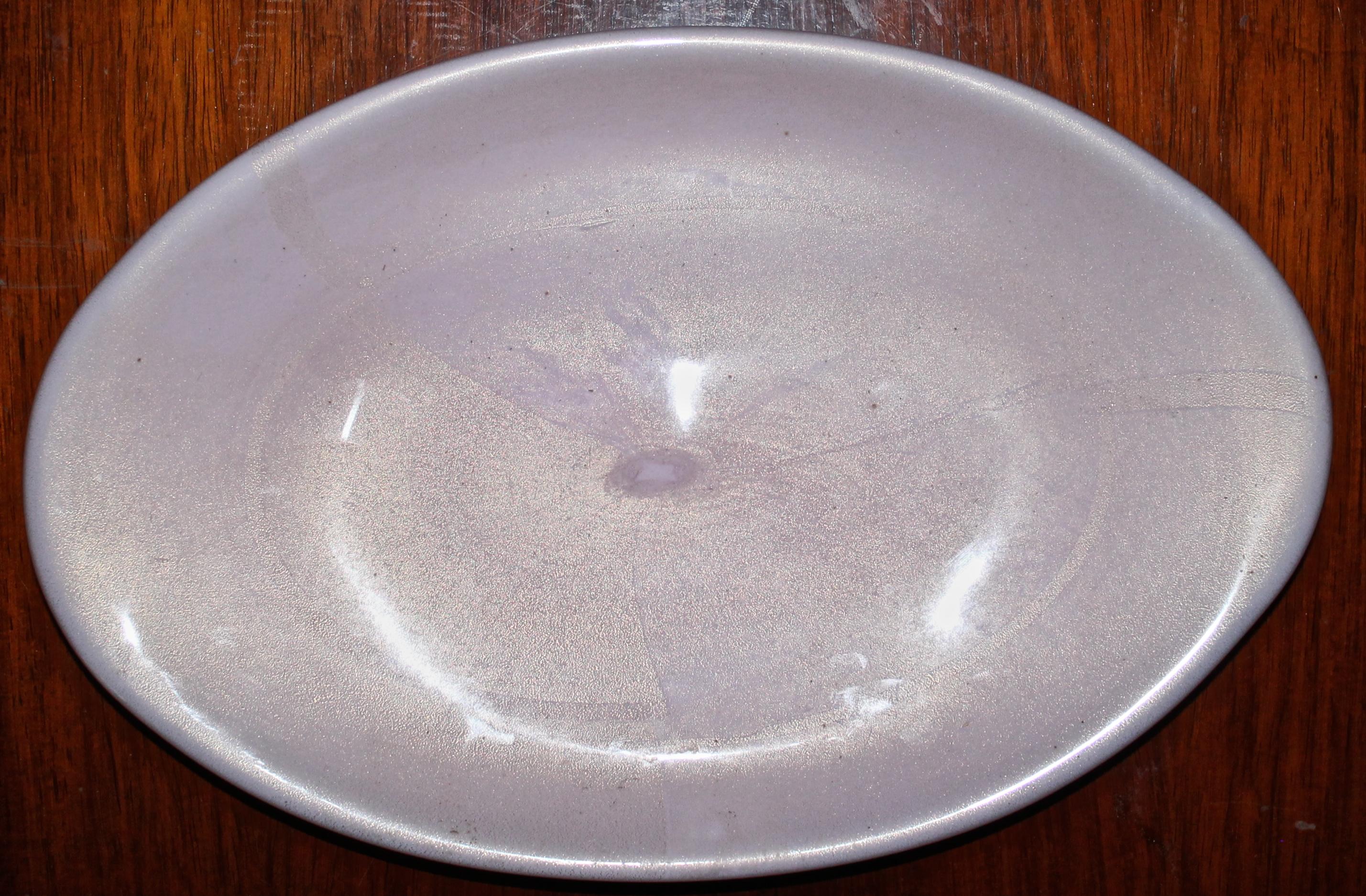 A large tray in the manner of Carlo Scarpa. Loosely oval shaped pink vetri within a clear gold wash.