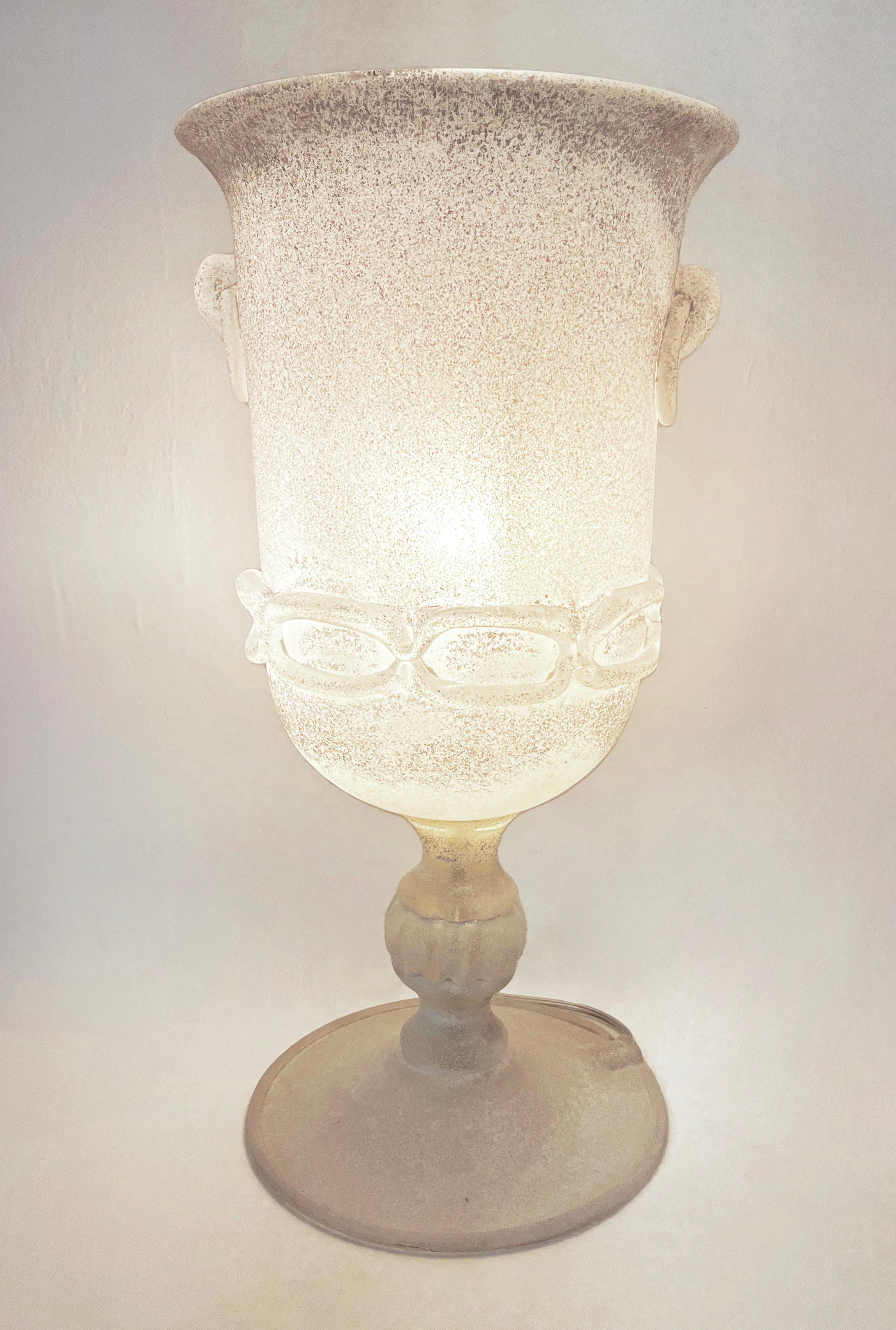 A rare Italian mid-century modern organic Murano glass lamp, with Florentine neoclassical urn shape, by Seguso, precious because worked with an exceptional Scavo technique that gives an unusual stone antique look as if the piece had been excavated.