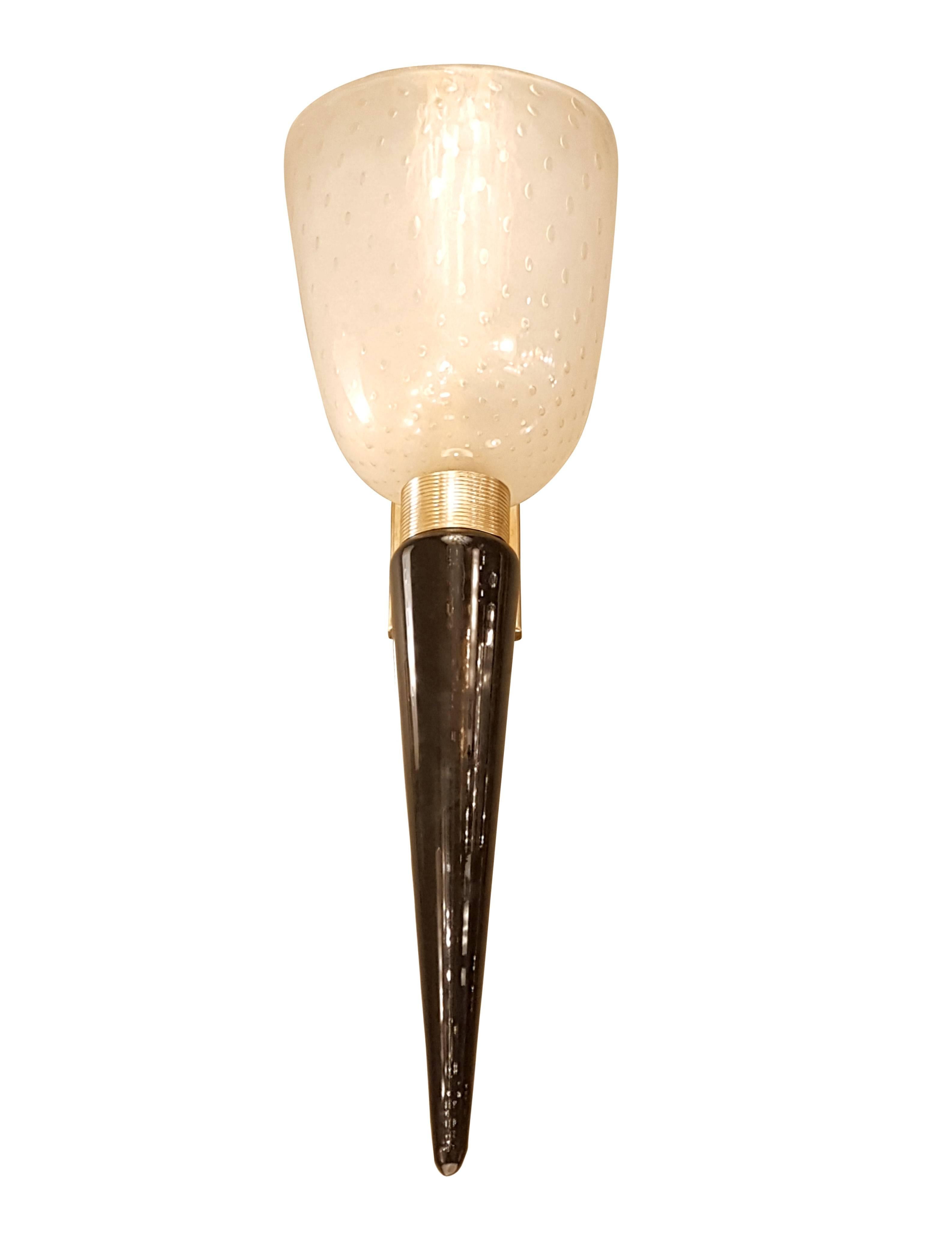Pair of Seguso Italian Mid-Century Modern Murano glass sconces.
Brass mounts, with nice patina, one medium base light each, rewired.
They have a black opaque Murano glass stem, and a top Bullicante technique vase, containing the light.
Bullicante