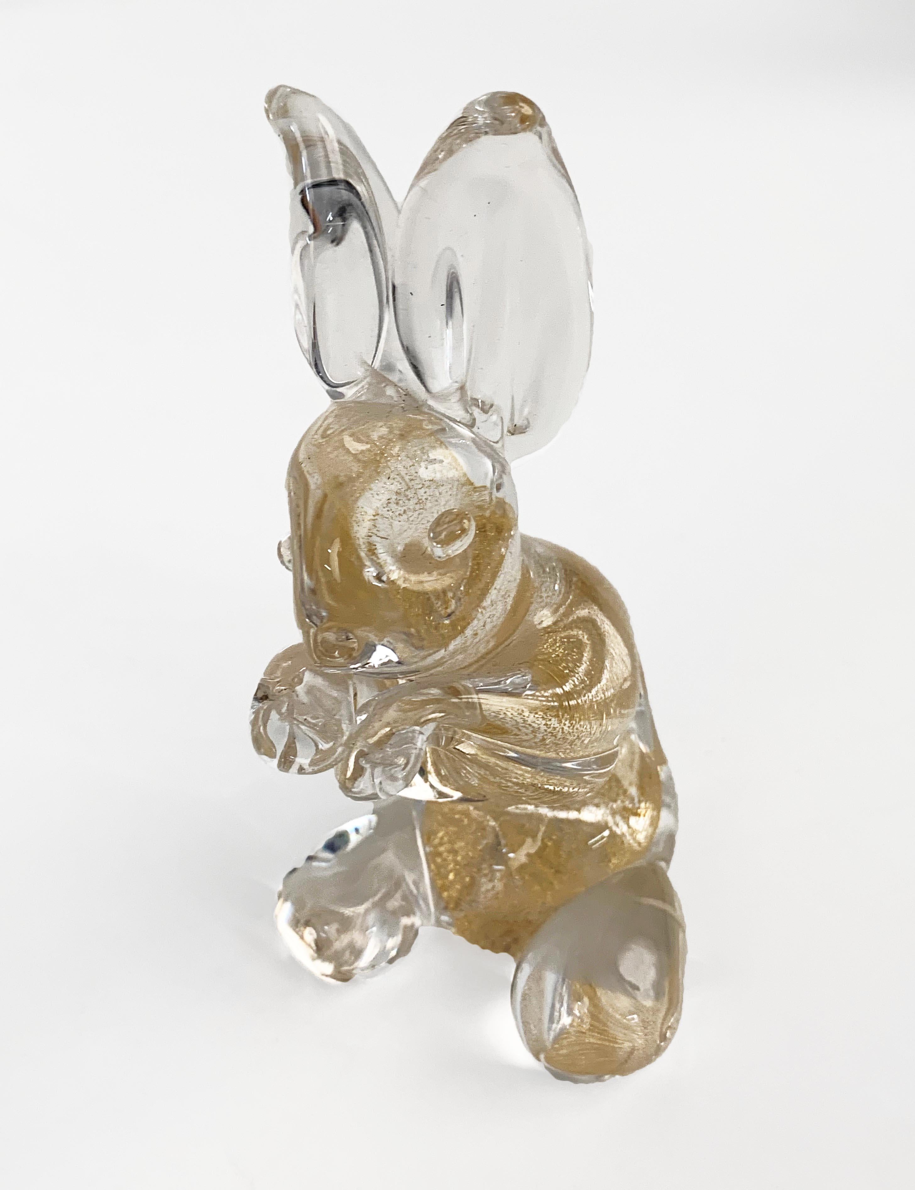 Beautiful midcentury hand blown artistic Murano glass rabbit sculpture with golden dots. This fantastic object was designed by Archimede Seguso and produced in Italy in the 1960s. Original label 