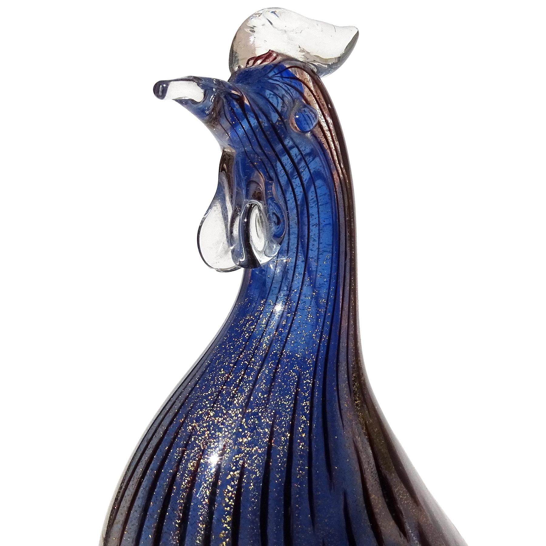Beautiful and rare, vintage Murano hand blown sapphire blue, gold flecks and dark spots Italian art glass guinea bird figurine sculpture. Documented to designer Archimede Seguso, circa 1950s. Created in the 
